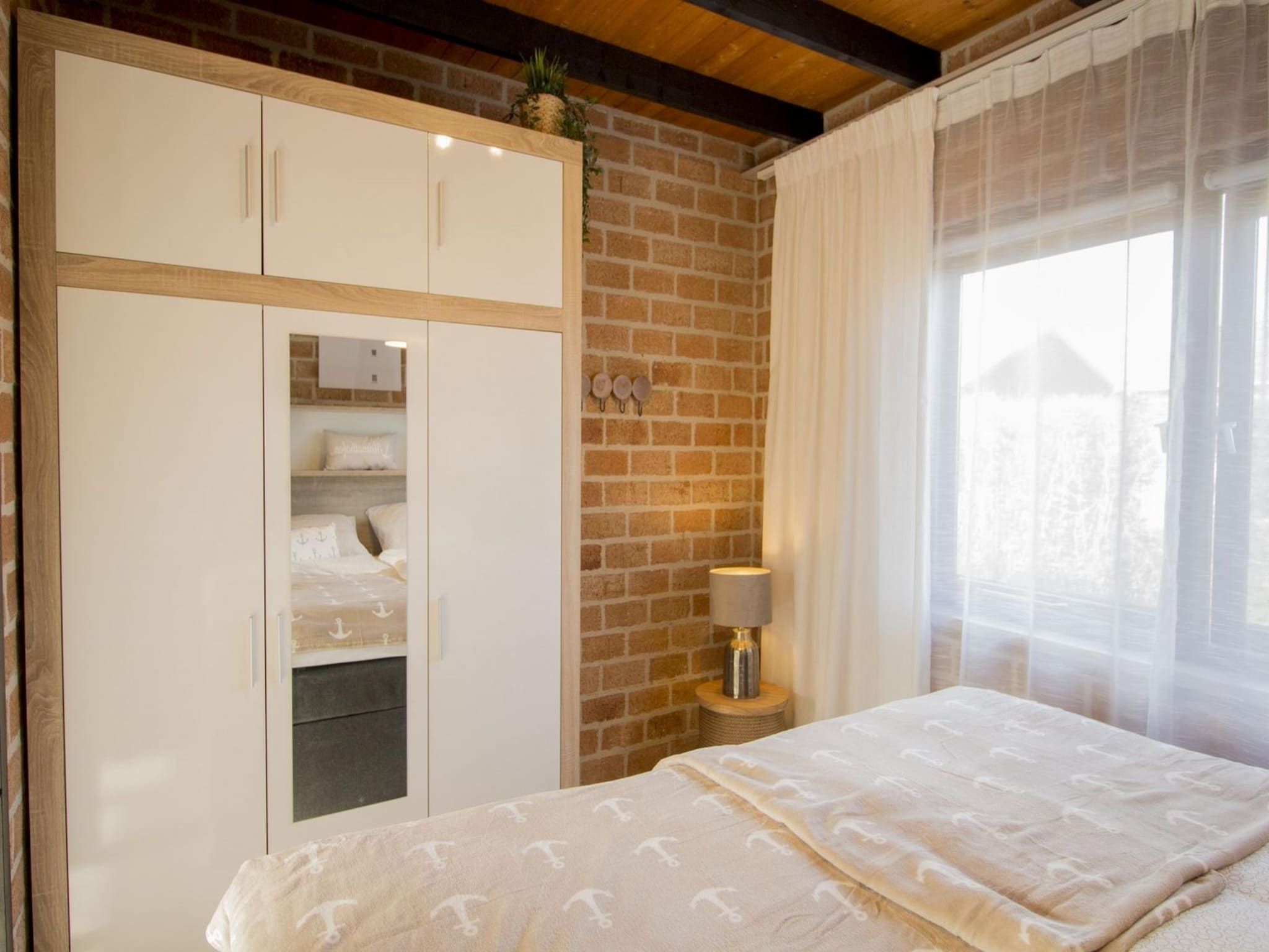 Een slaapkamer van Boerenslag 28 in Sint Maartenszee