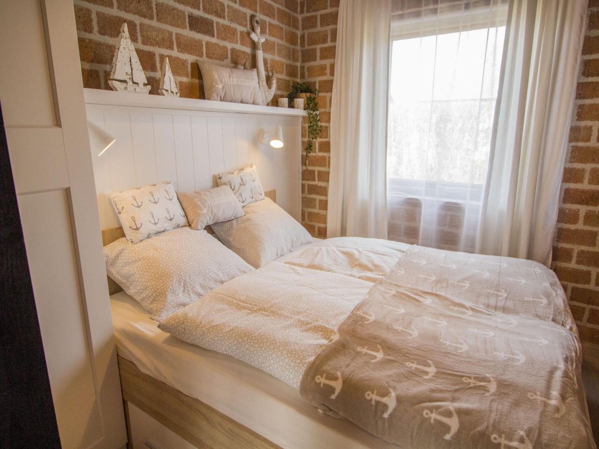 Een slaapkamer van Boerenslag 28 in Sint Maartenszee