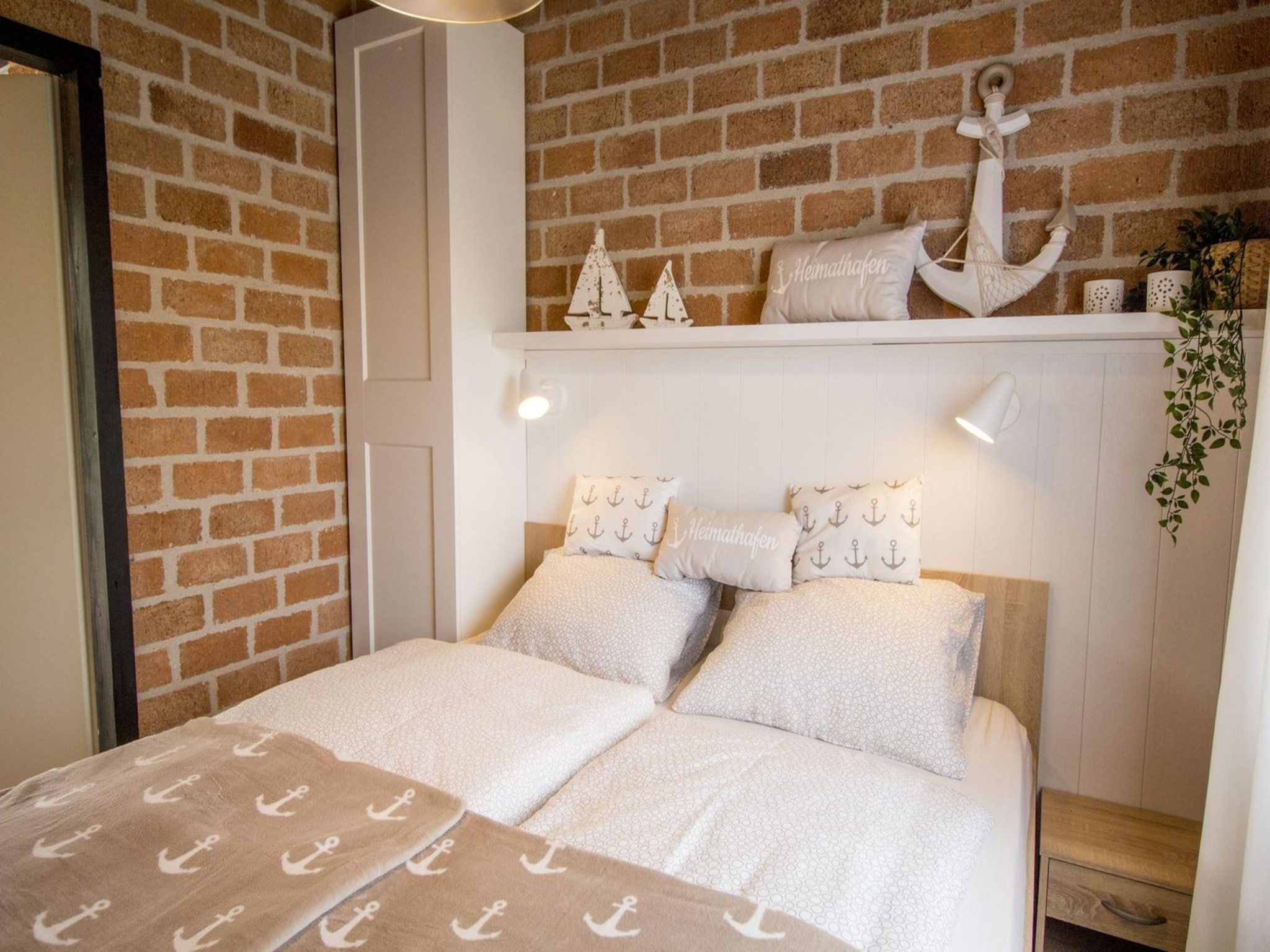 Een slaapkamer van Boerenslag 28 in Sint Maartenszee