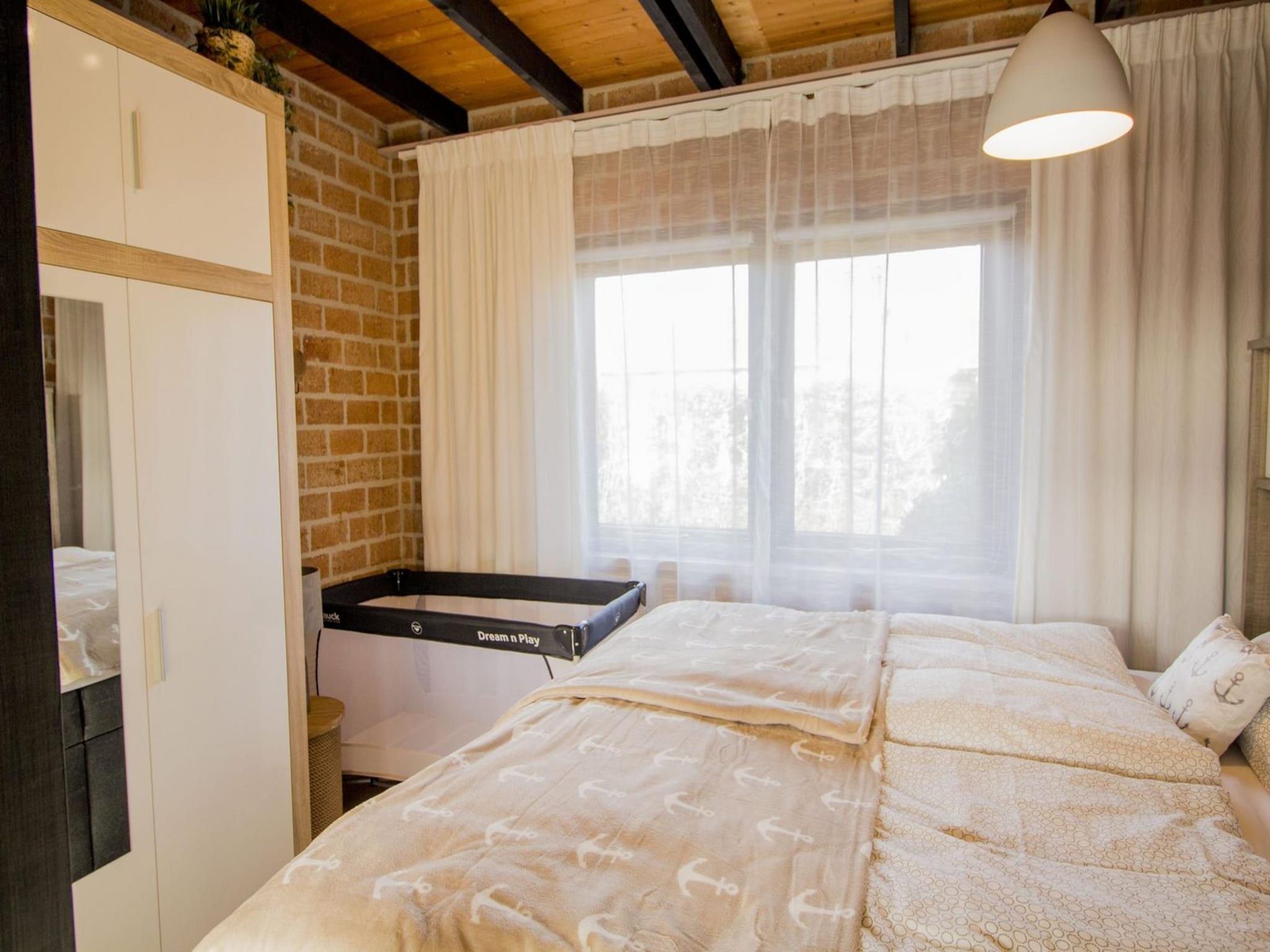 Een slaapkamer van Boerenslag 28 in Sint Maartenszee