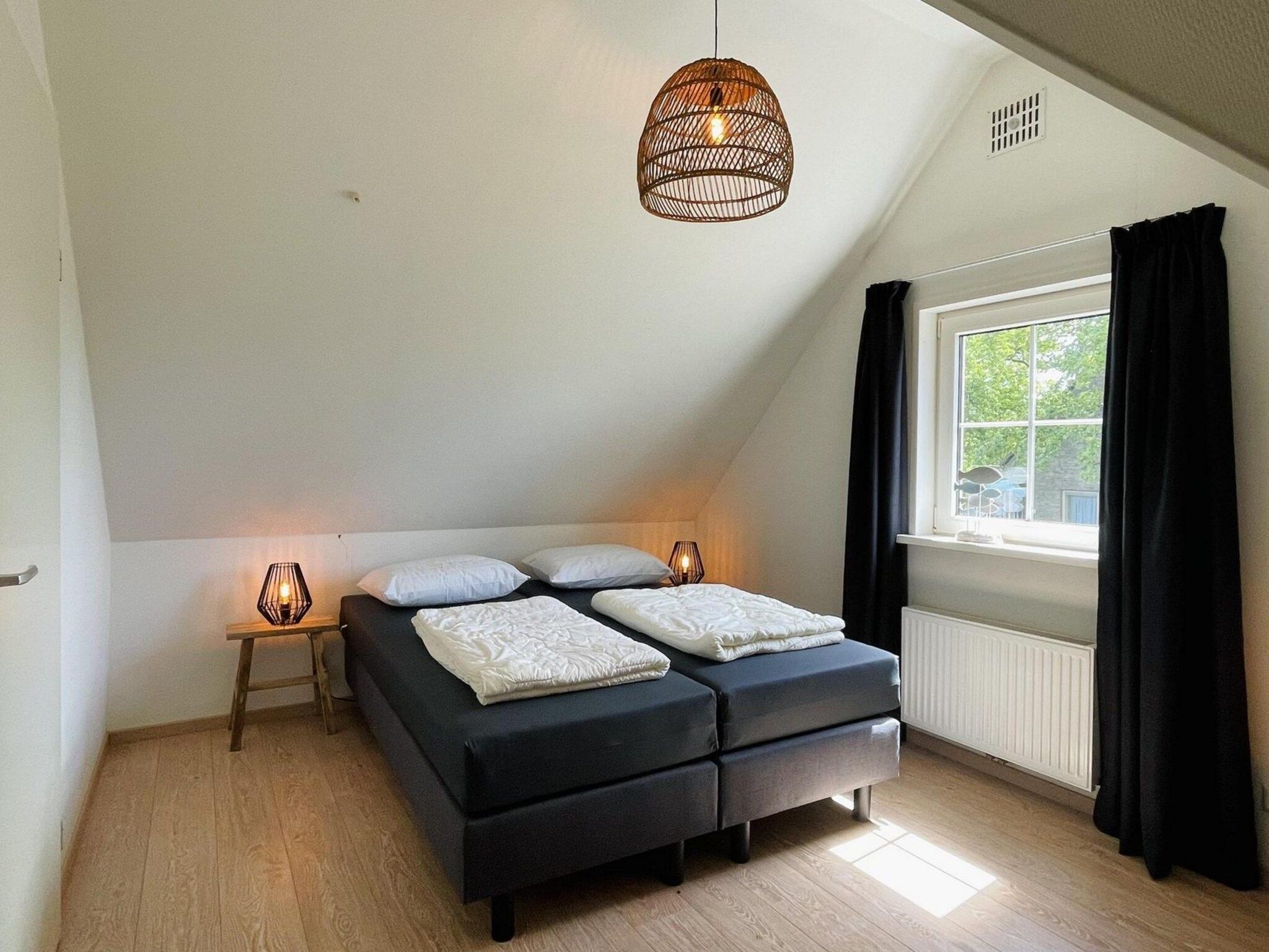 Een slaapkamer van Anzelhoef Apartment Oost in Sint Maartenszee