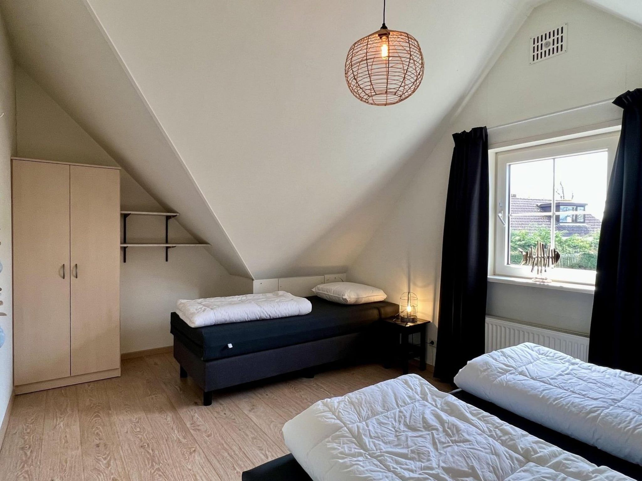 Een slaapkamer van Anzelhoef apartment West in Sint Maartenszee