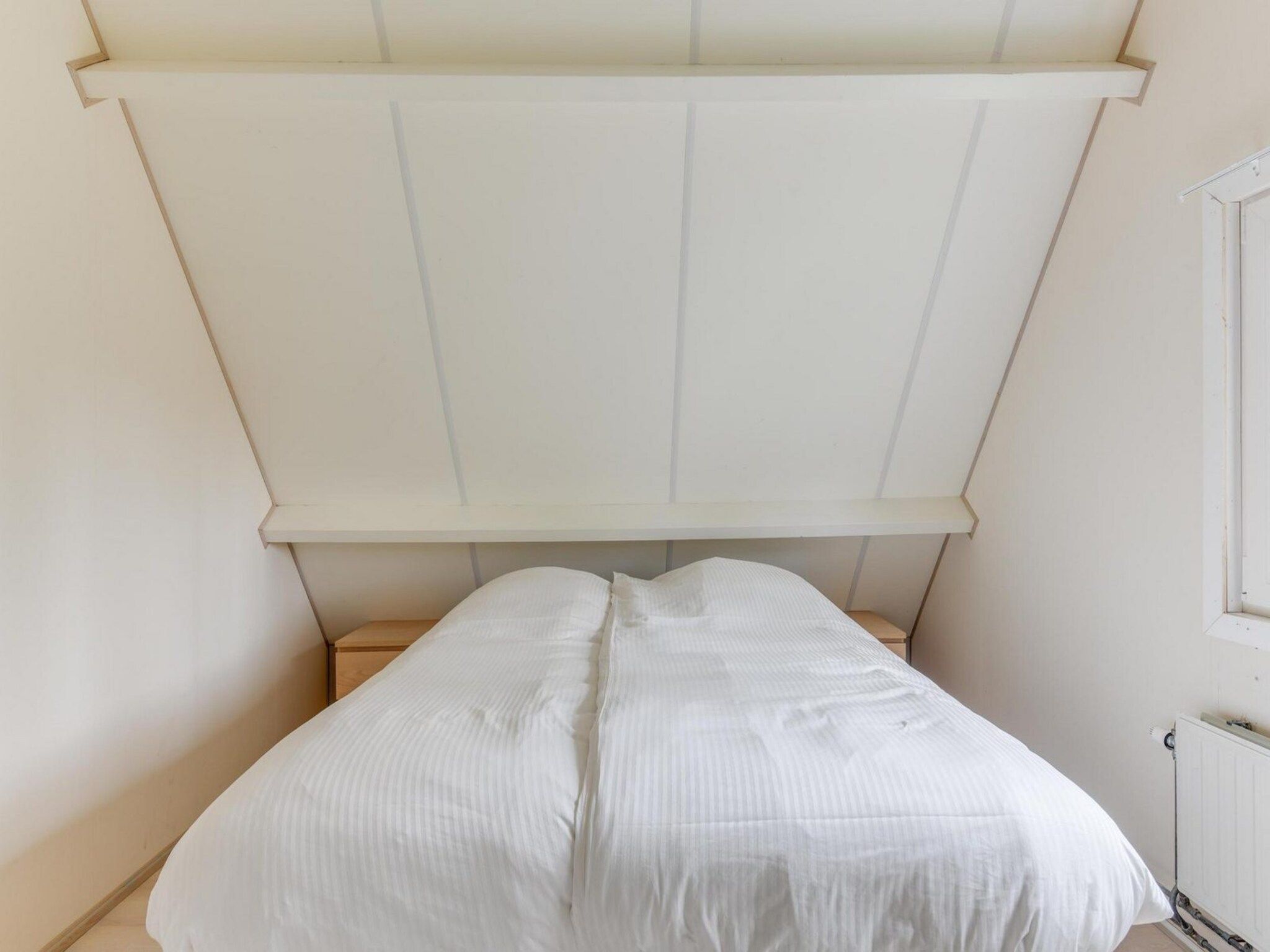 Een slaapkamer van Gudea 1 in Sint Maartensbrug