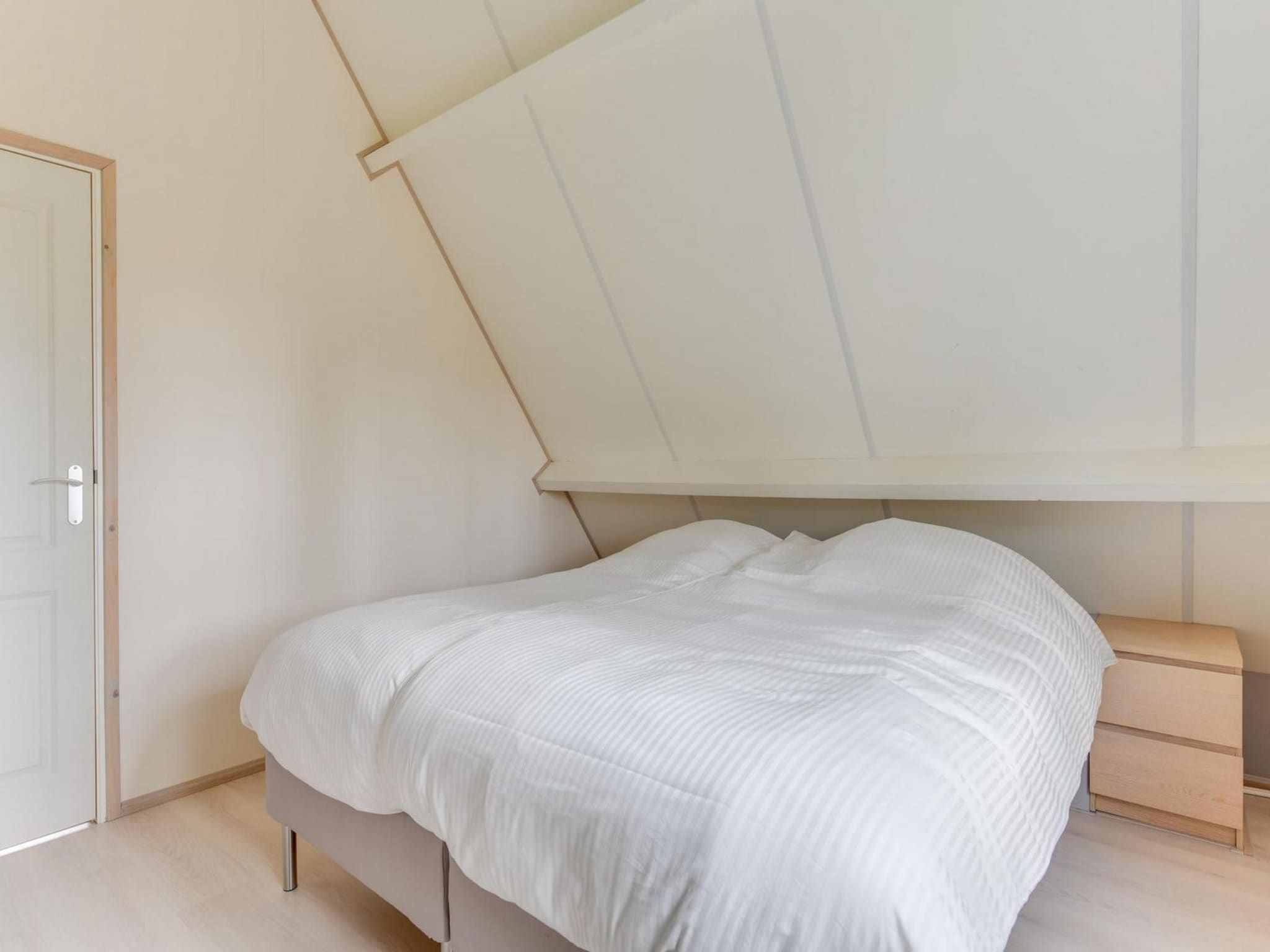 Een slaapkamer van Gudea 1 in Sint Maartensbrug