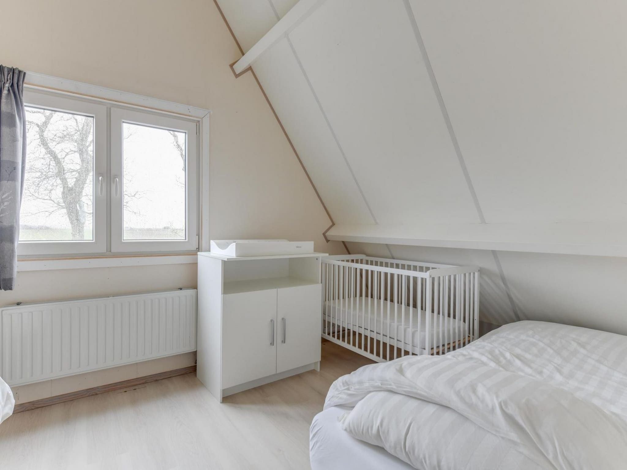 Een slaapkamer van Gudea 1 in Sint Maartensbrug