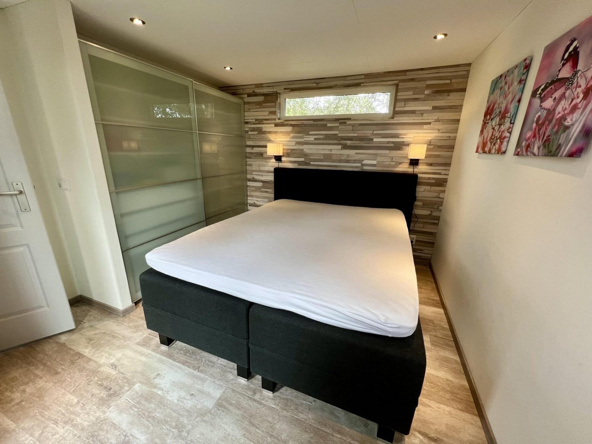 Een slaapkamer van Campanula 208 in Sint Maartenszee