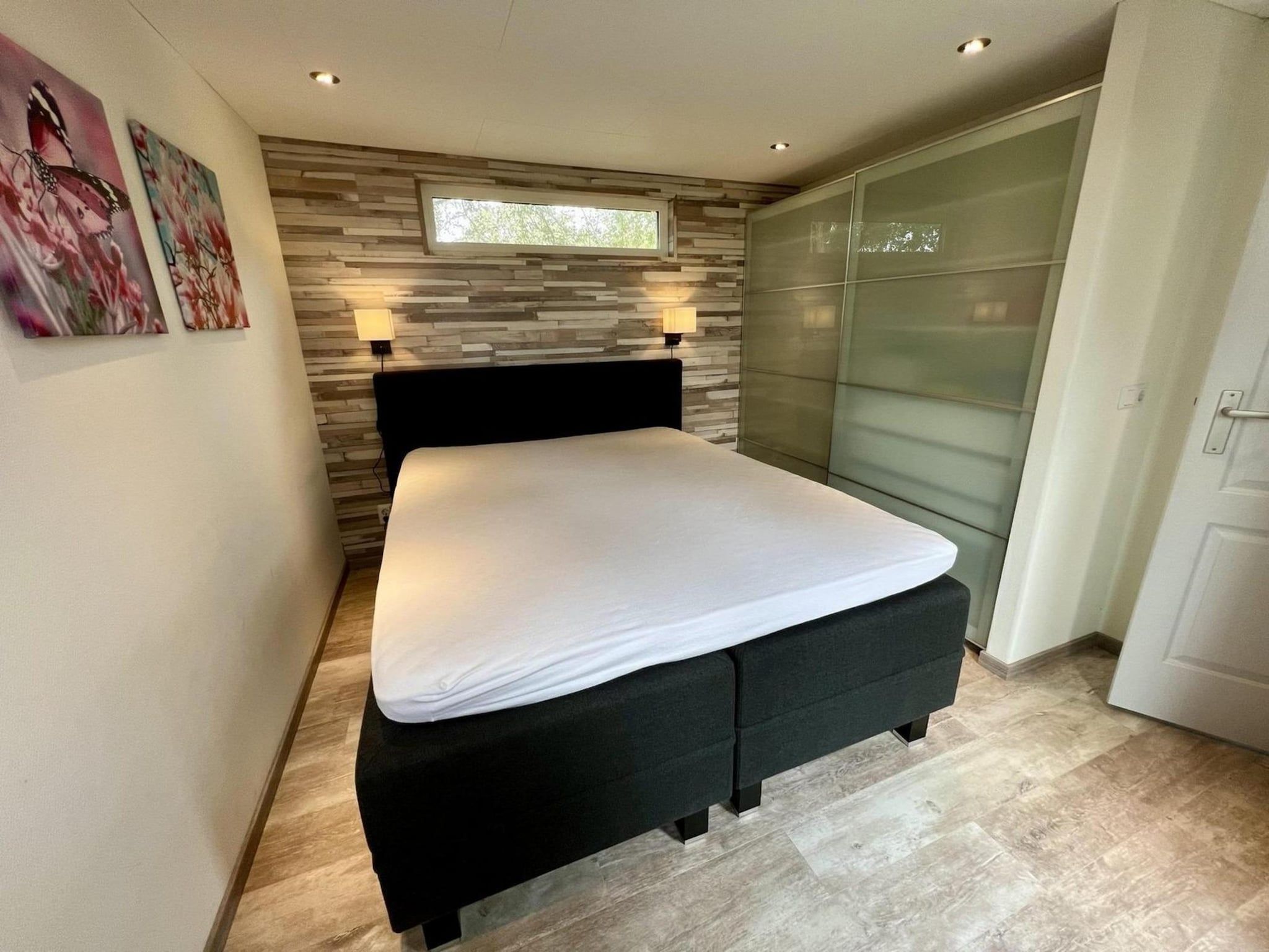 Een slaapkamer van Campanula 208 in Sint Maartenszee