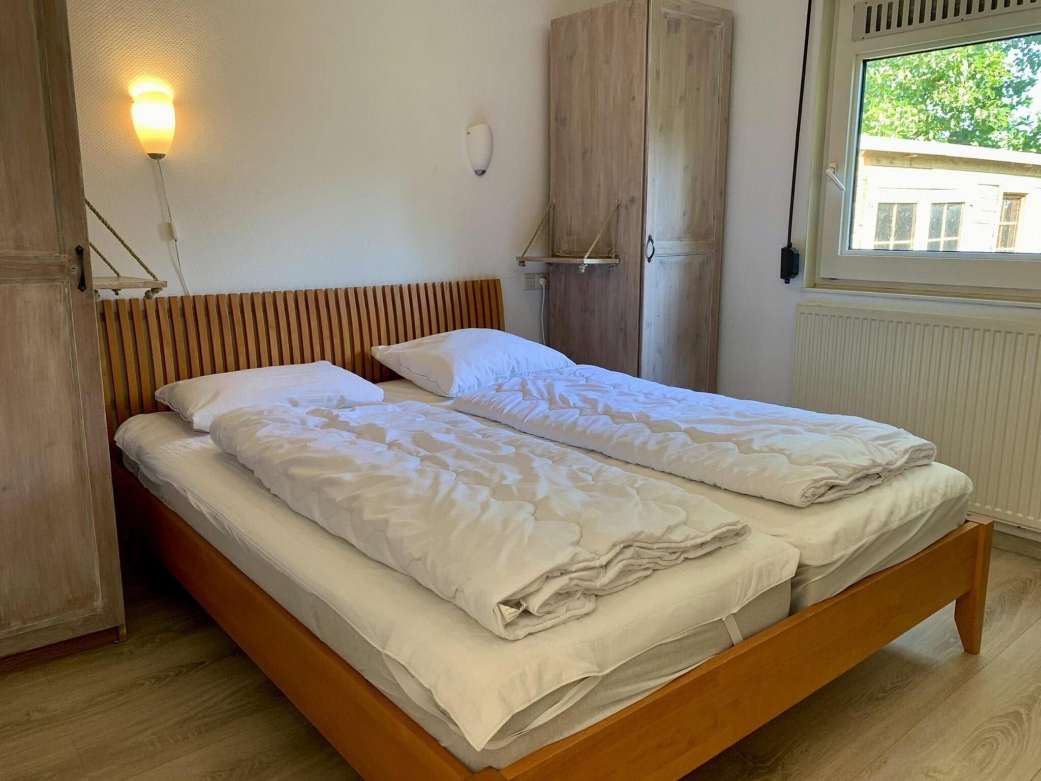 Een slaapkamer van Eureka 061 in Sint Maartenszee