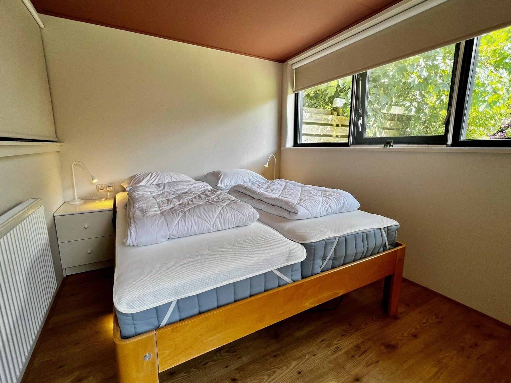 Een slaapkamer van Wildrijk 092 -"C'est la vie" in Sint Maartenszee