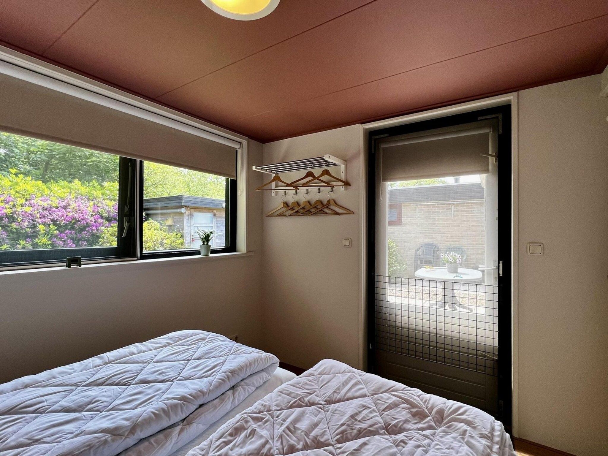 Een slaapkamer van Wildrijk 092 -"C'est la vie" in Sint Maartenszee