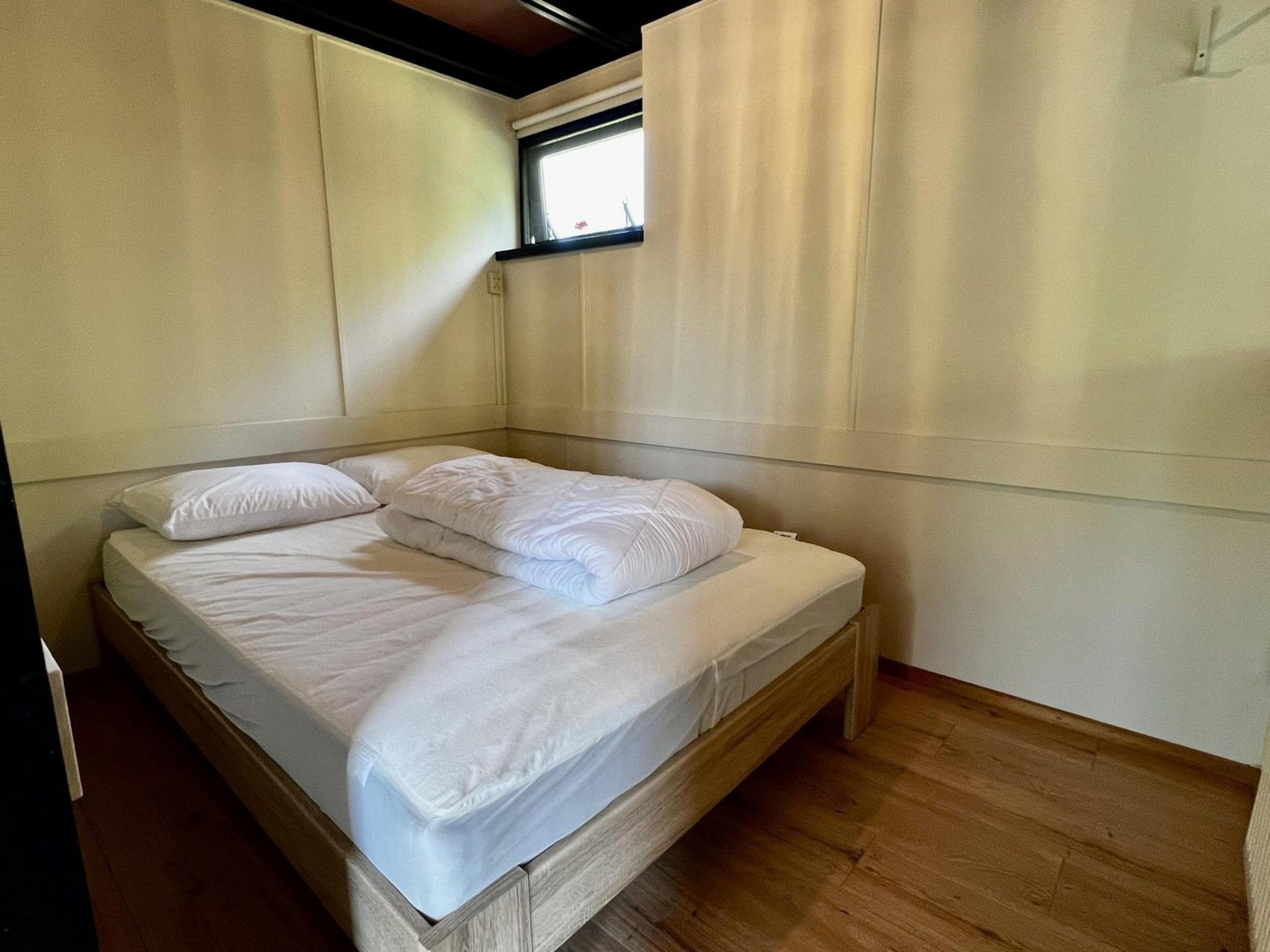 Een slaapkamer van Wildrijk 092 -"C'est la vie" in Sint Maartenszee