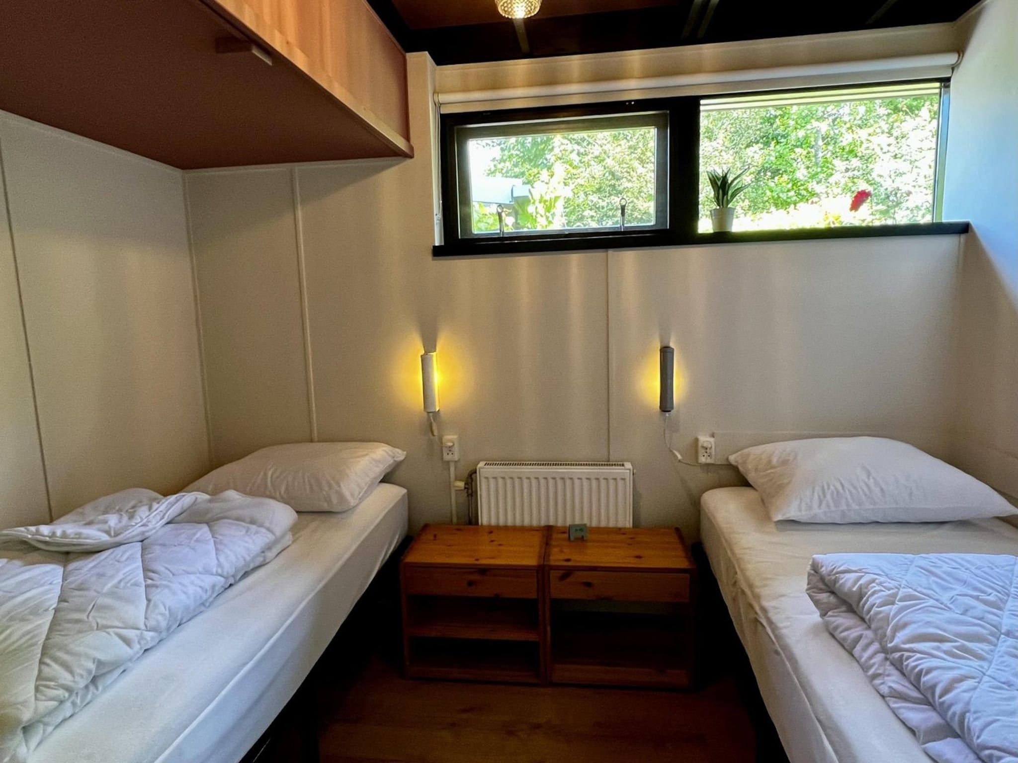 Een slaapkamer van Wildrijk 092 -"C'est la vie" in Sint Maartenszee