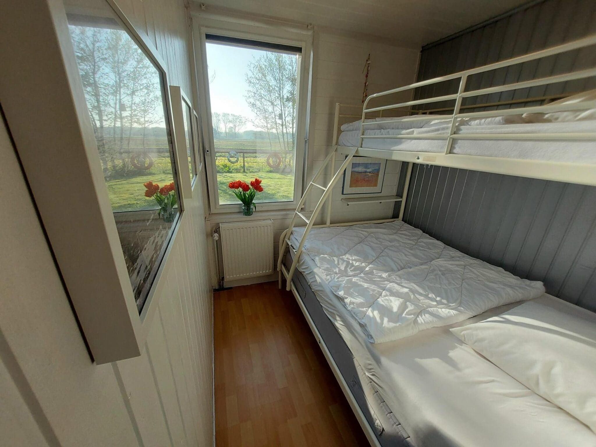 Een slaapkamer van Eureka 073 in Sint Maartenszee