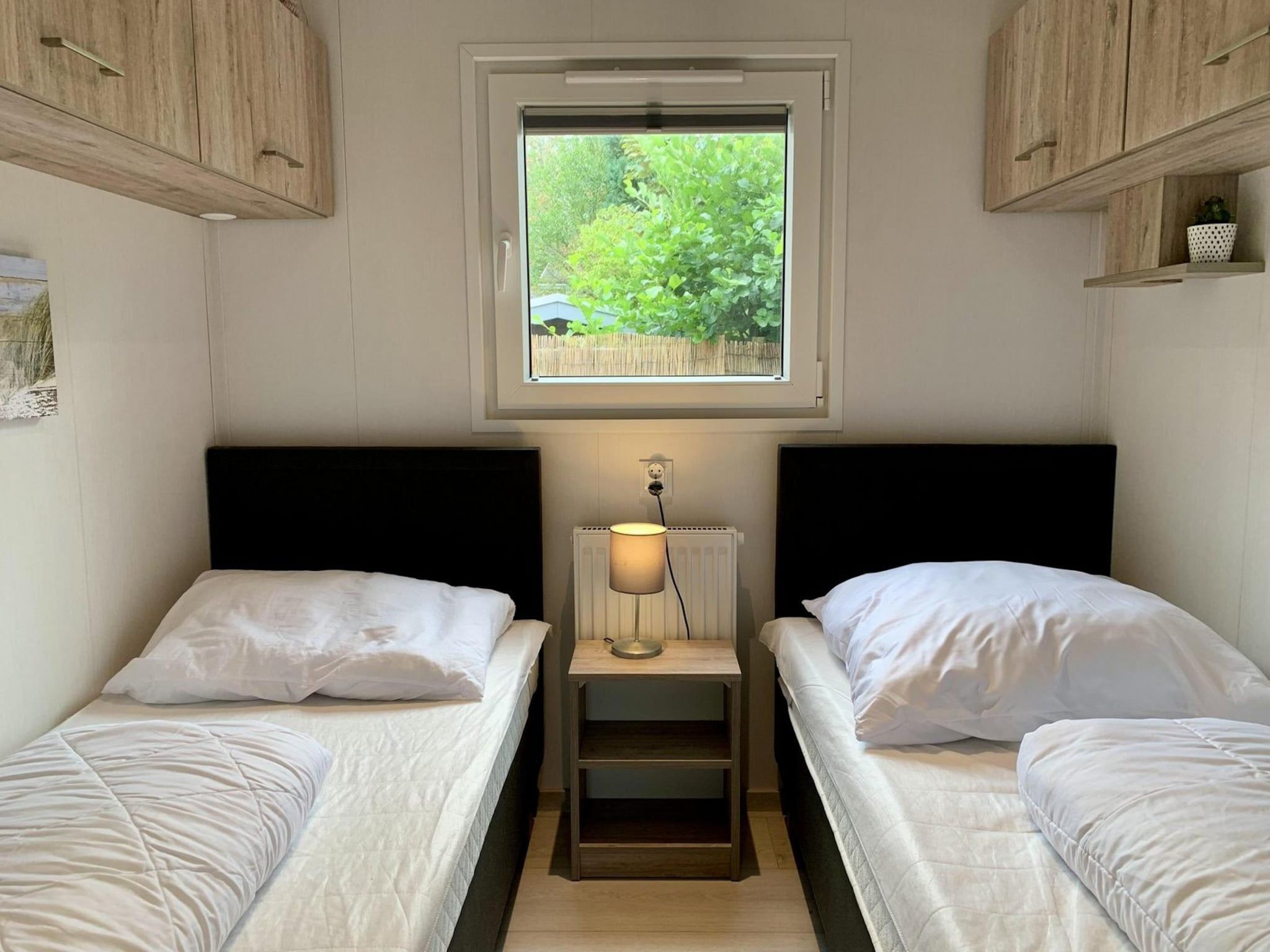 Een slaapkamer van Campanula 191 in Sint Maartenszee