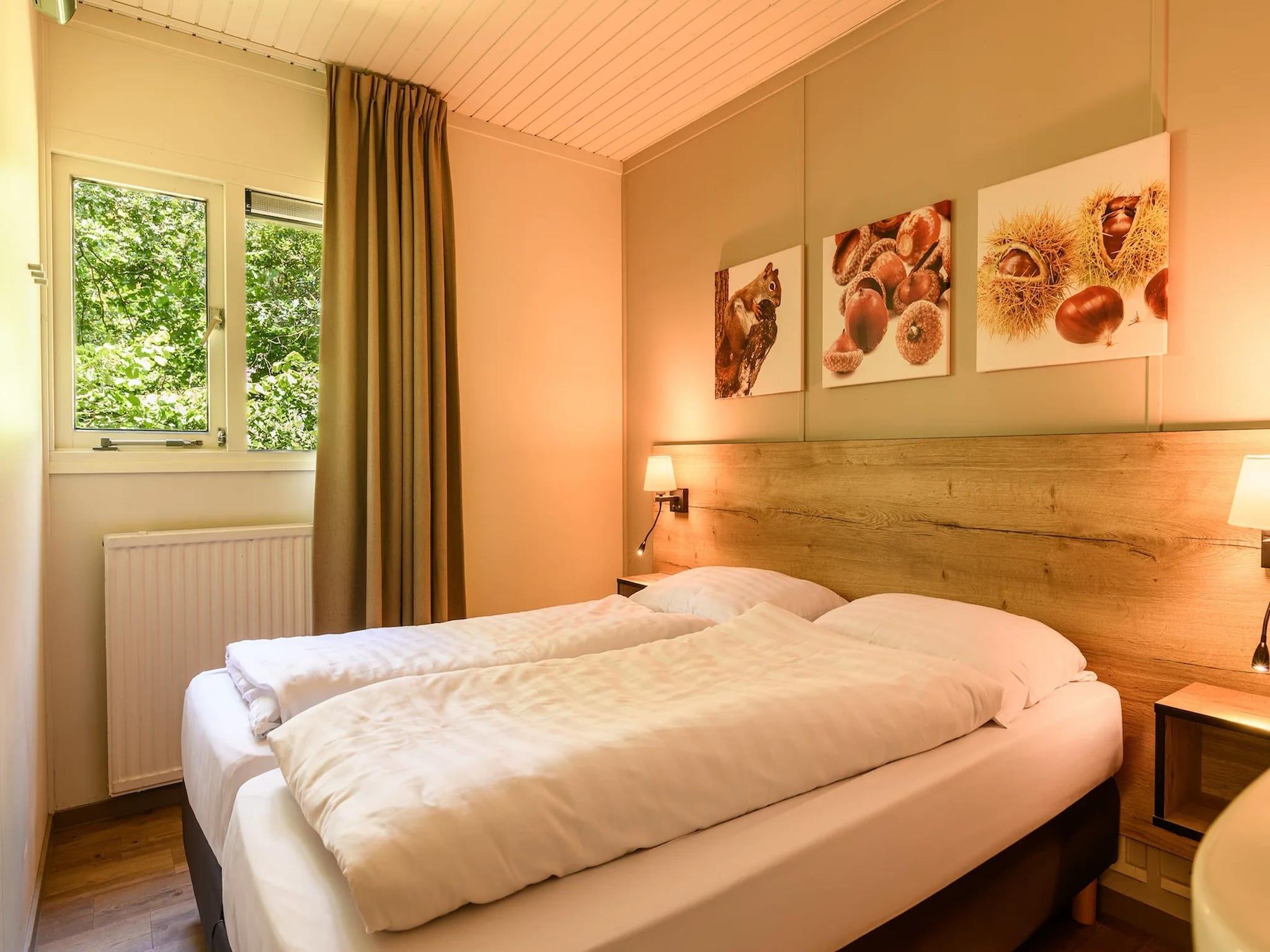 Een slaapkamer van Bungalow 6B1 in Putten