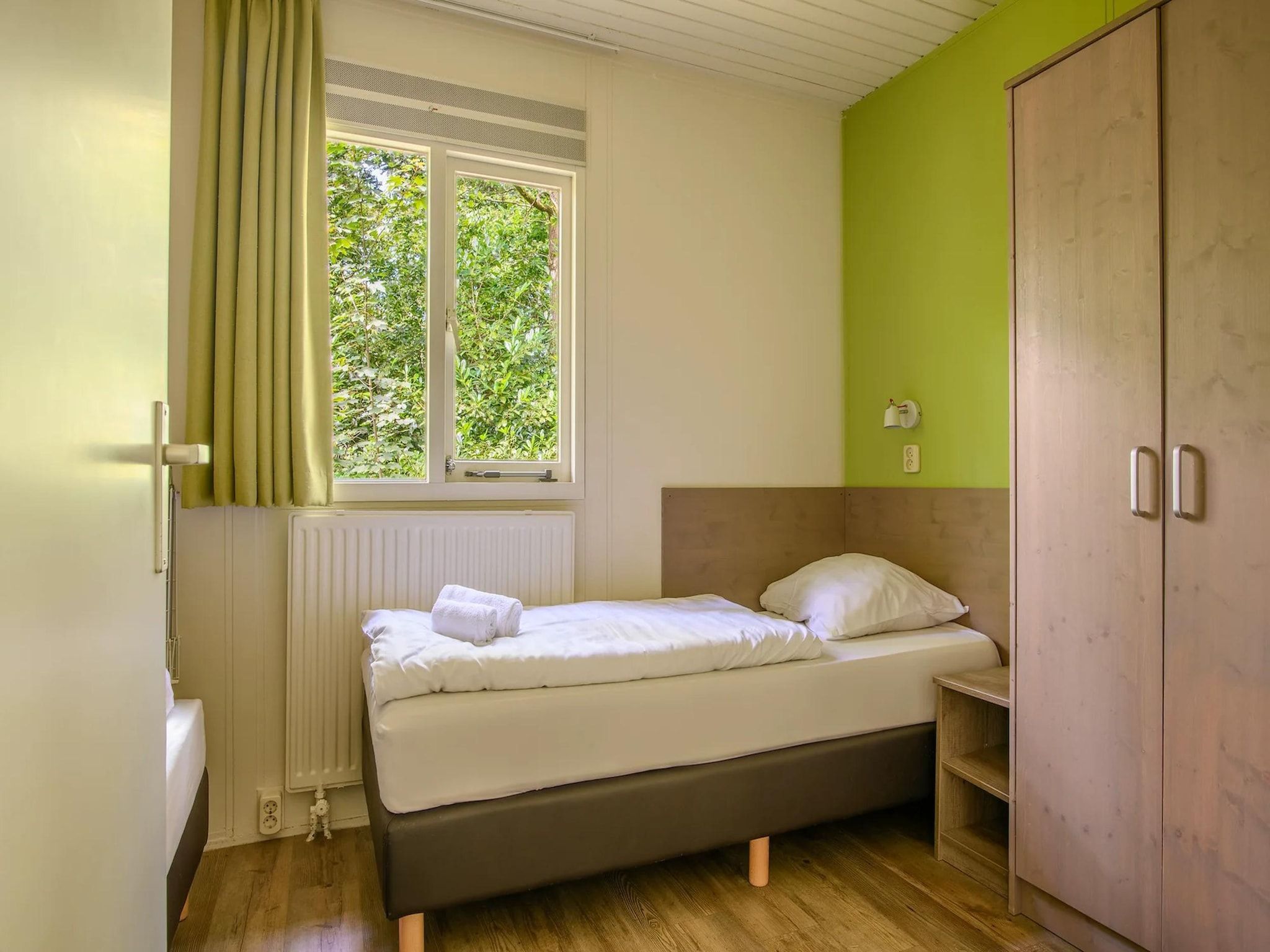 Een slaapkamer van Bungalow 4C3 in Putten