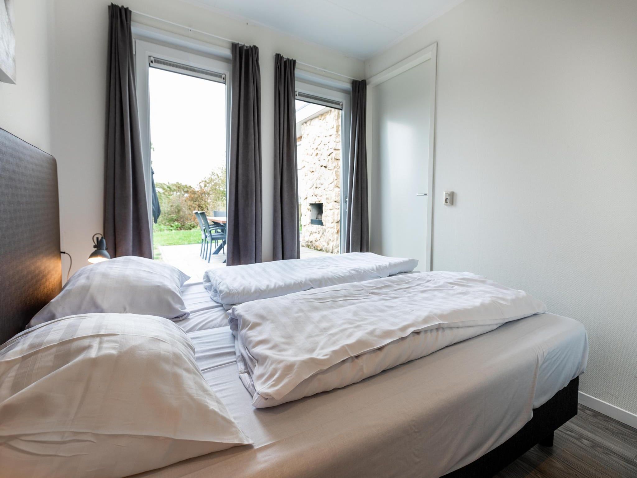 Een slaapkamer van Ravenbosch - Sauna in Bemelen