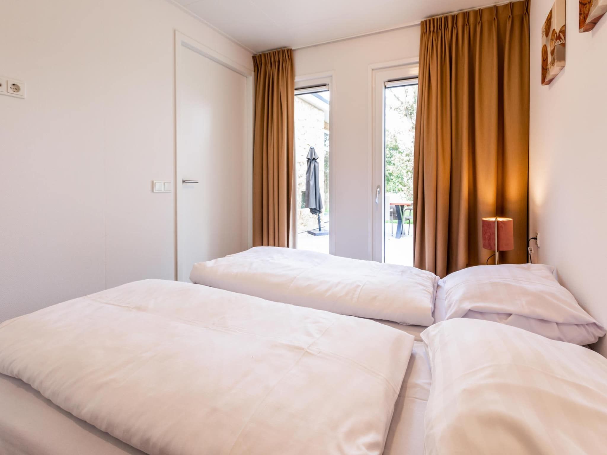 Een slaapkamer van Ravenbosch - Garden Shed in Bemelen