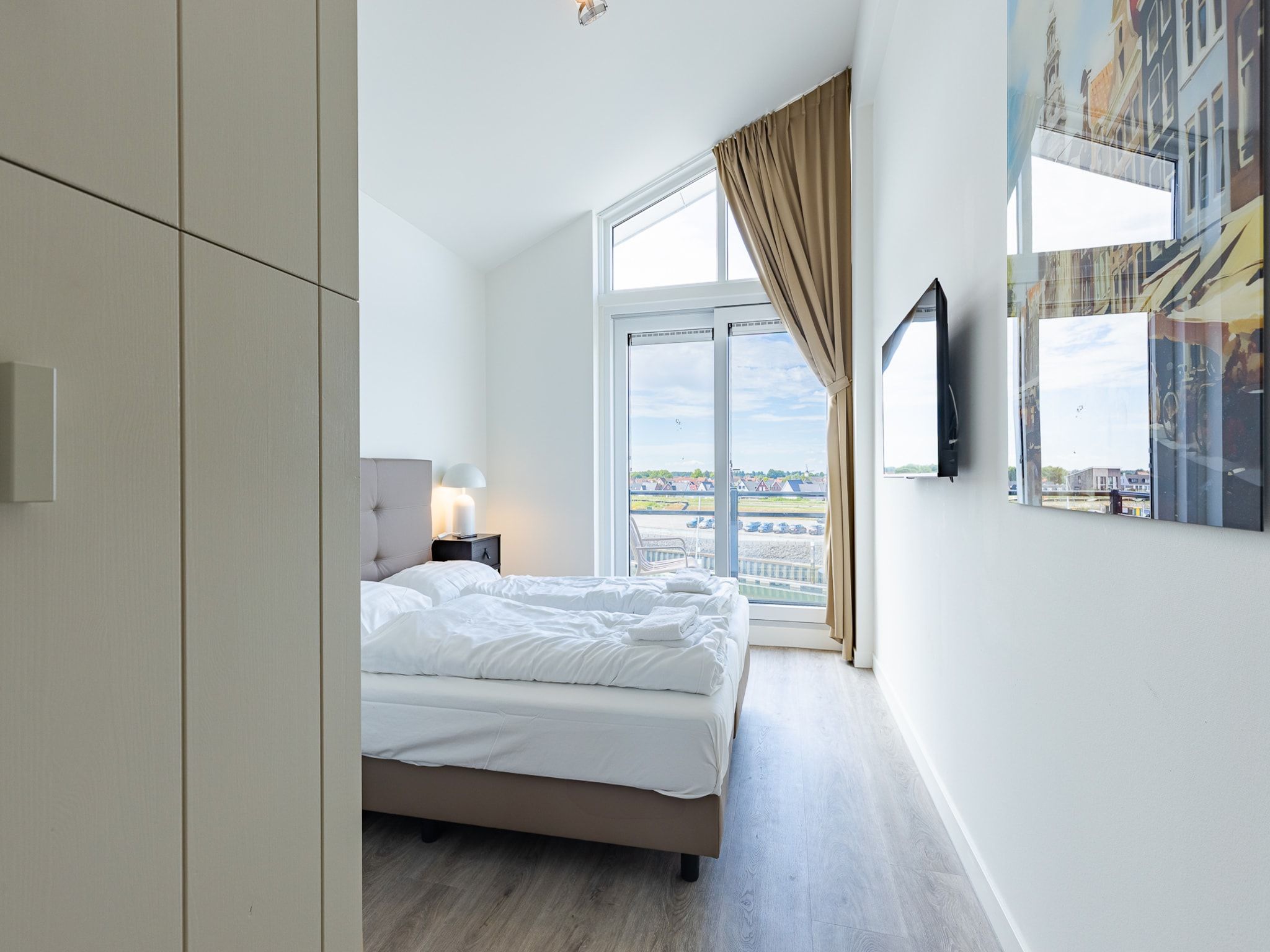 Een slaapkamer van Appartement Vista Maris 'Haus am See' - Havenweg 8-30  Sint-Annaland in Sint-Annaland