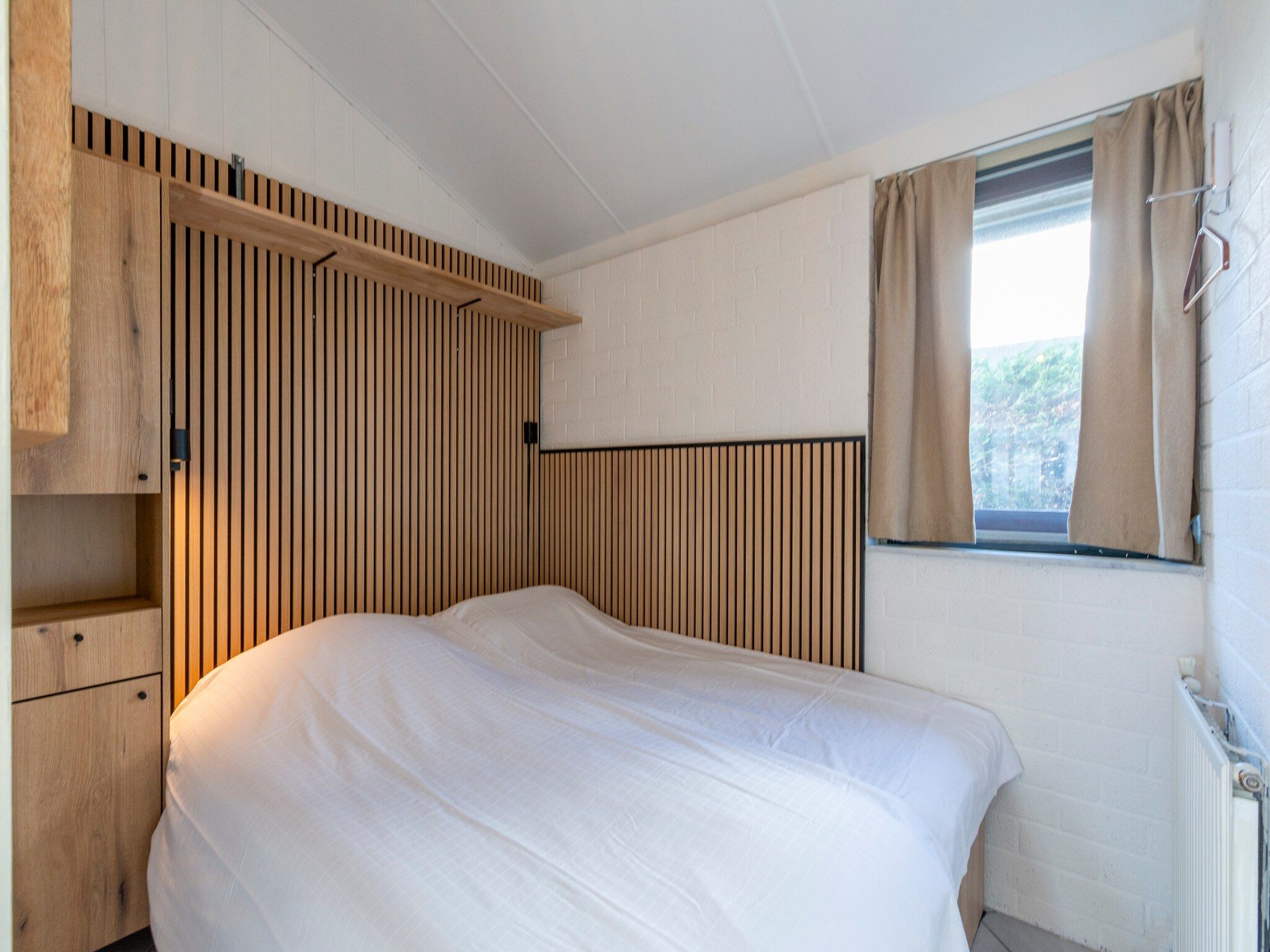 Een slaapkamer van Watersnip 57 "Huis Skuumkoppe" in Petten