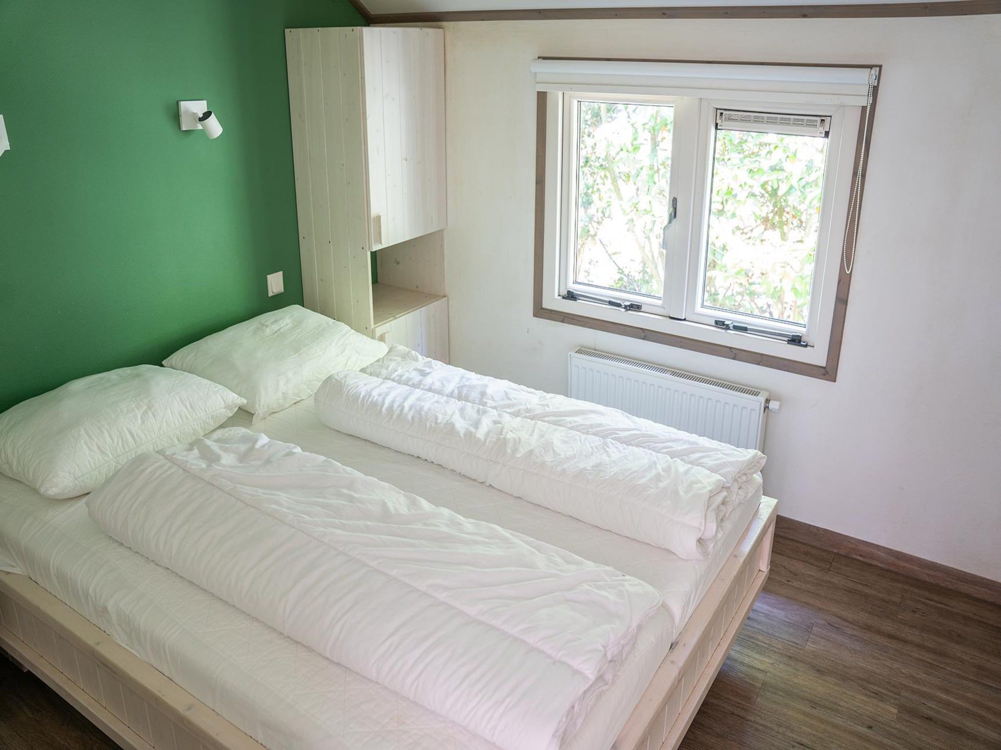 Een slaapkamer van Heivlinder 4+2p in Ermelo