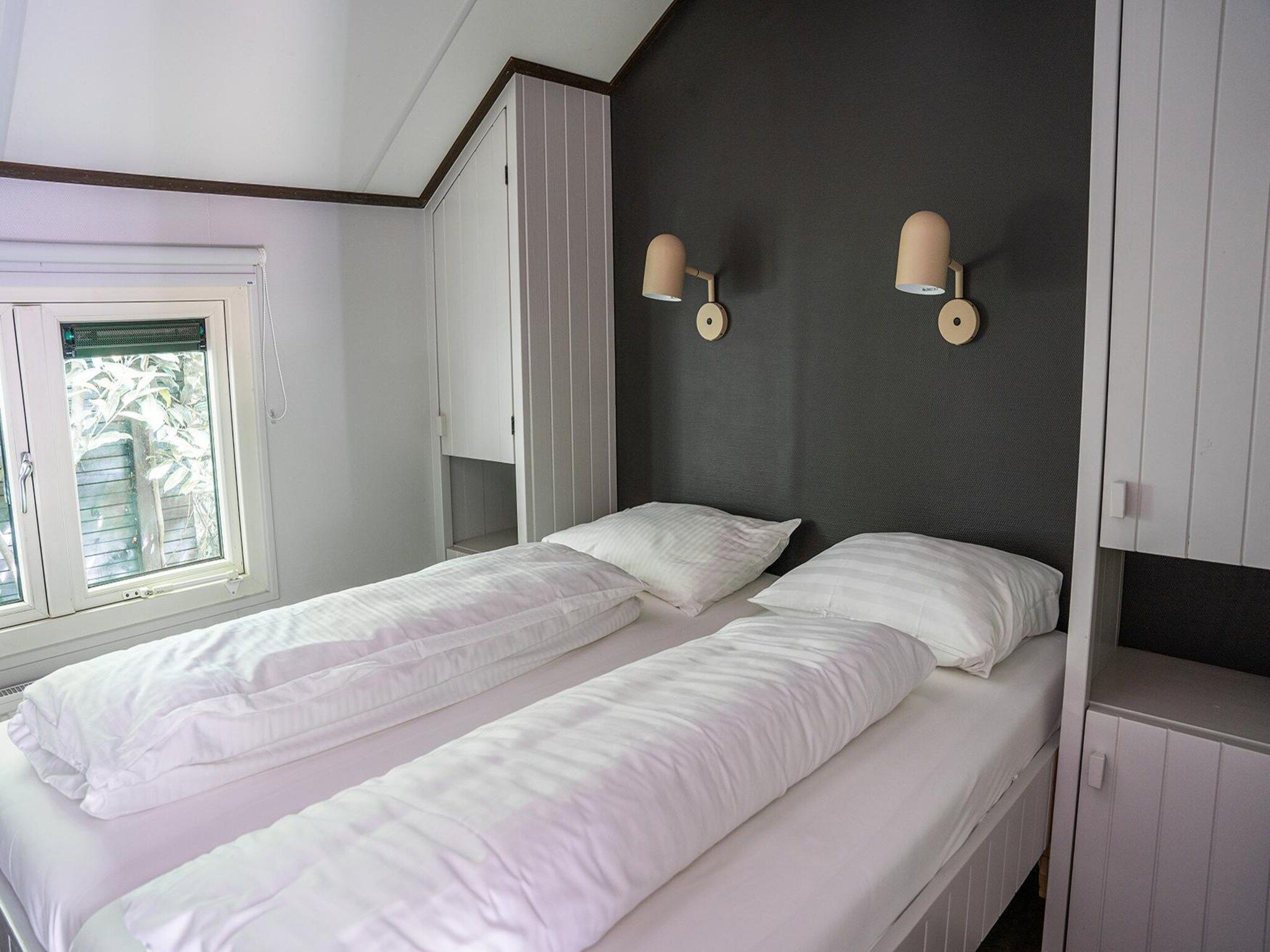 Een slaapkamer van Heivlinder 4+2p in Ermelo