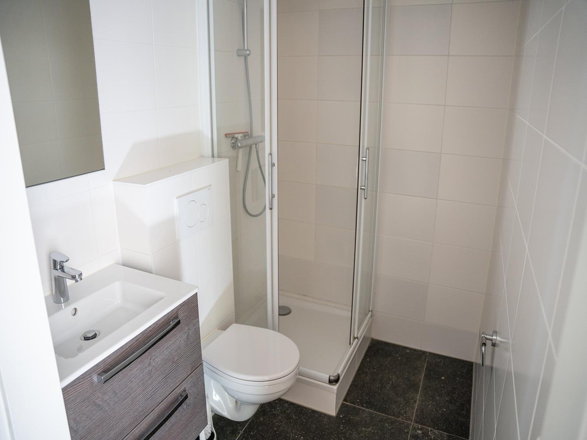 Een slaapkamer van Vlindervallei Boshuis 16p in Ermelo