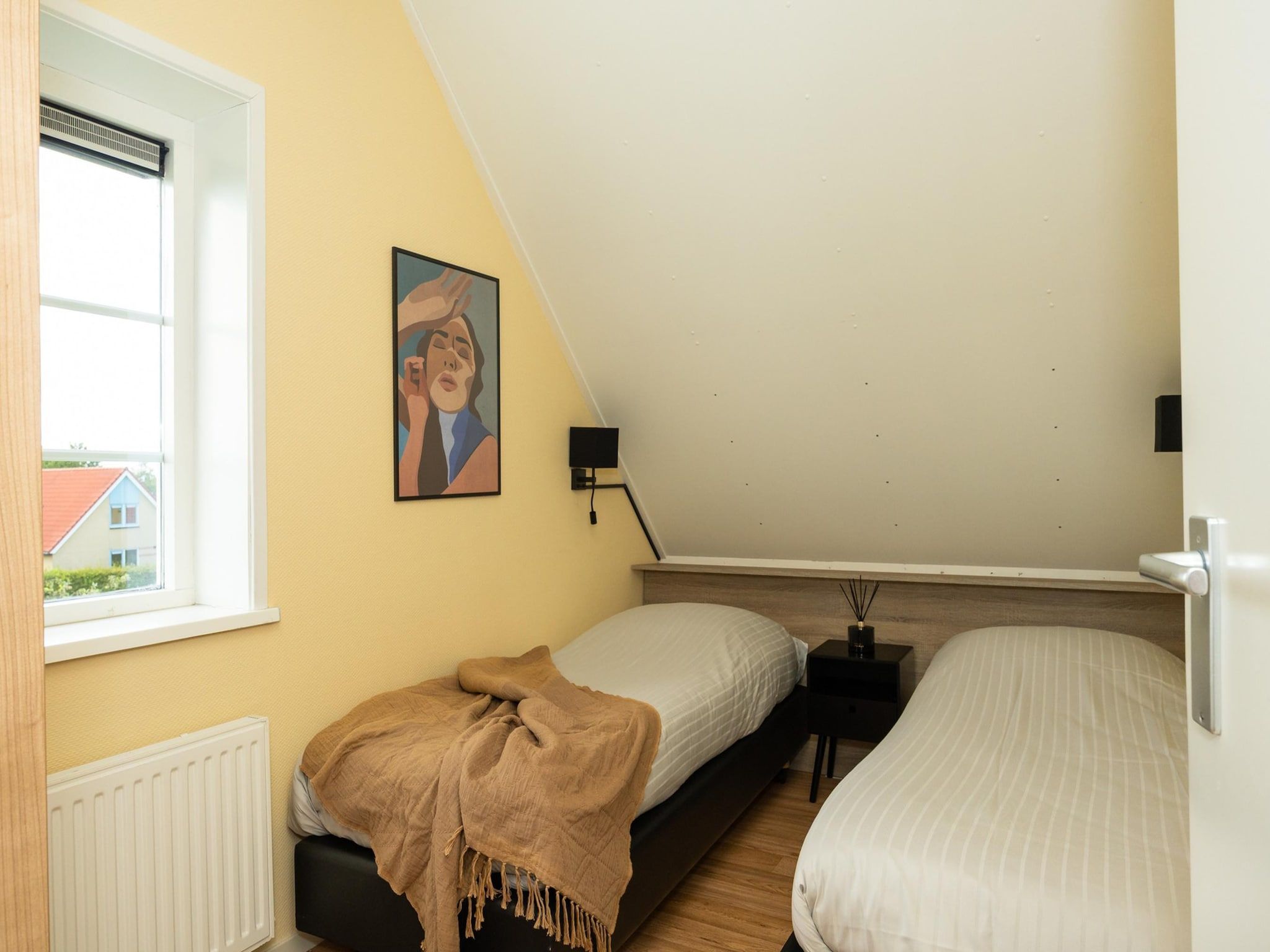 Een slaapkamer van Andijk 15 in Andijk