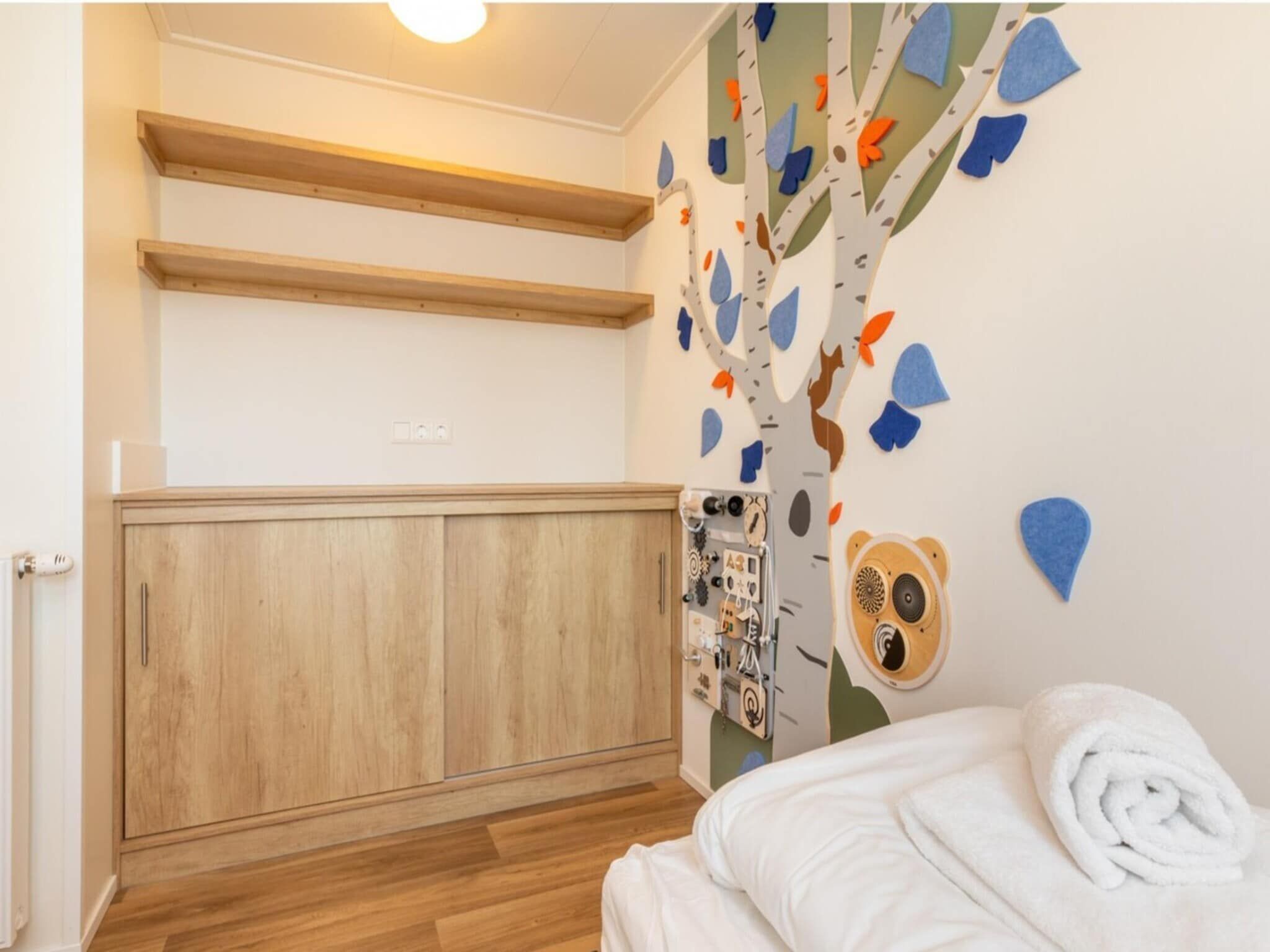 Een slaapkamer van Chalet - Camping de Duinhoeve 'Bosdier' in Burgh-Haamstede