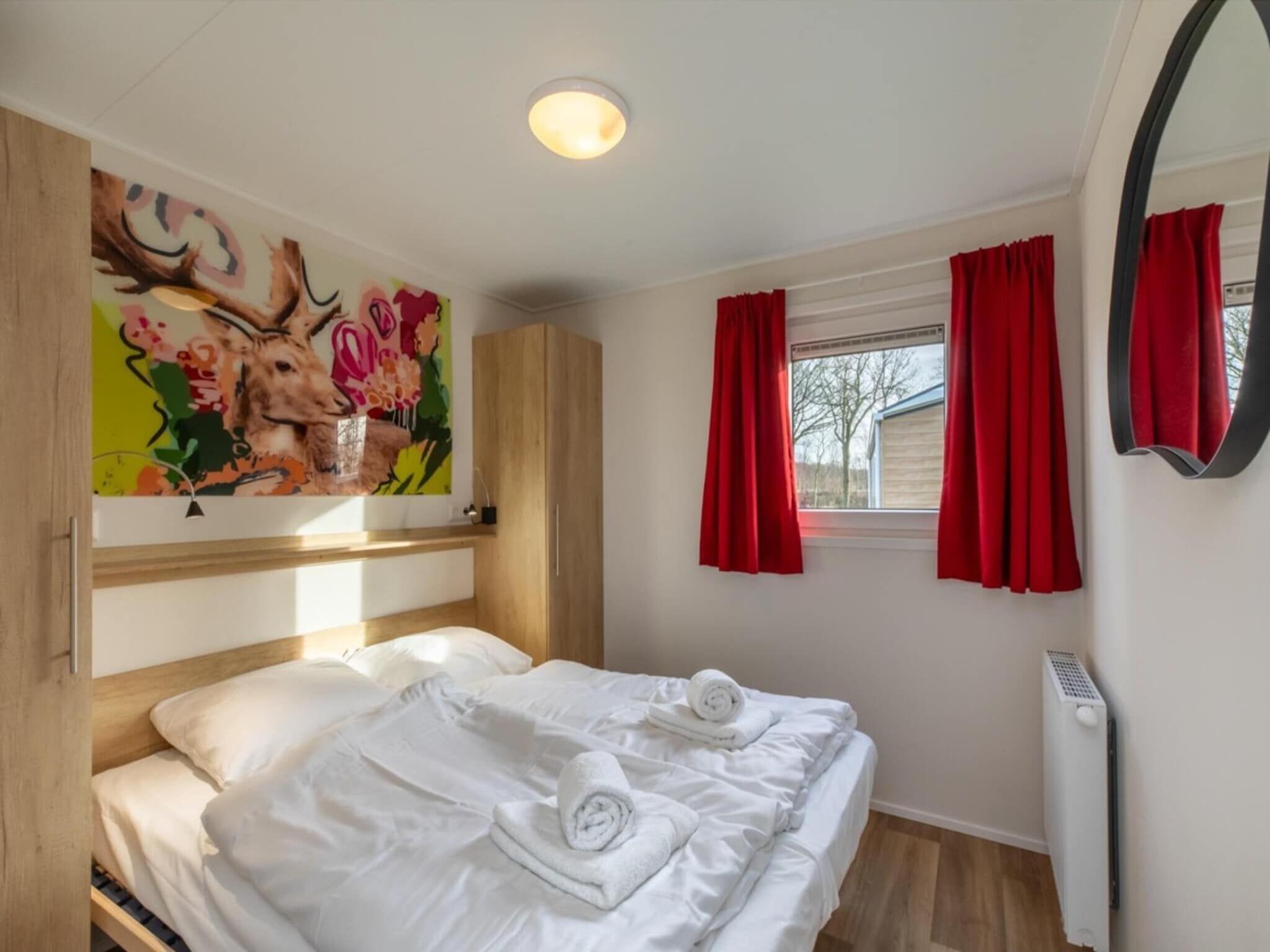 Een slaapkamer van Chalet - Camping de Duinhoeve 'Bosdier' in Burgh-Haamstede