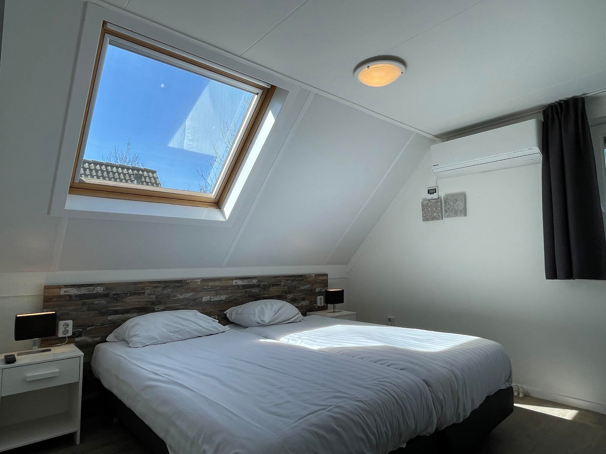 Een slaapkamer van Dijkhuis Wellness 6 in Medemblik