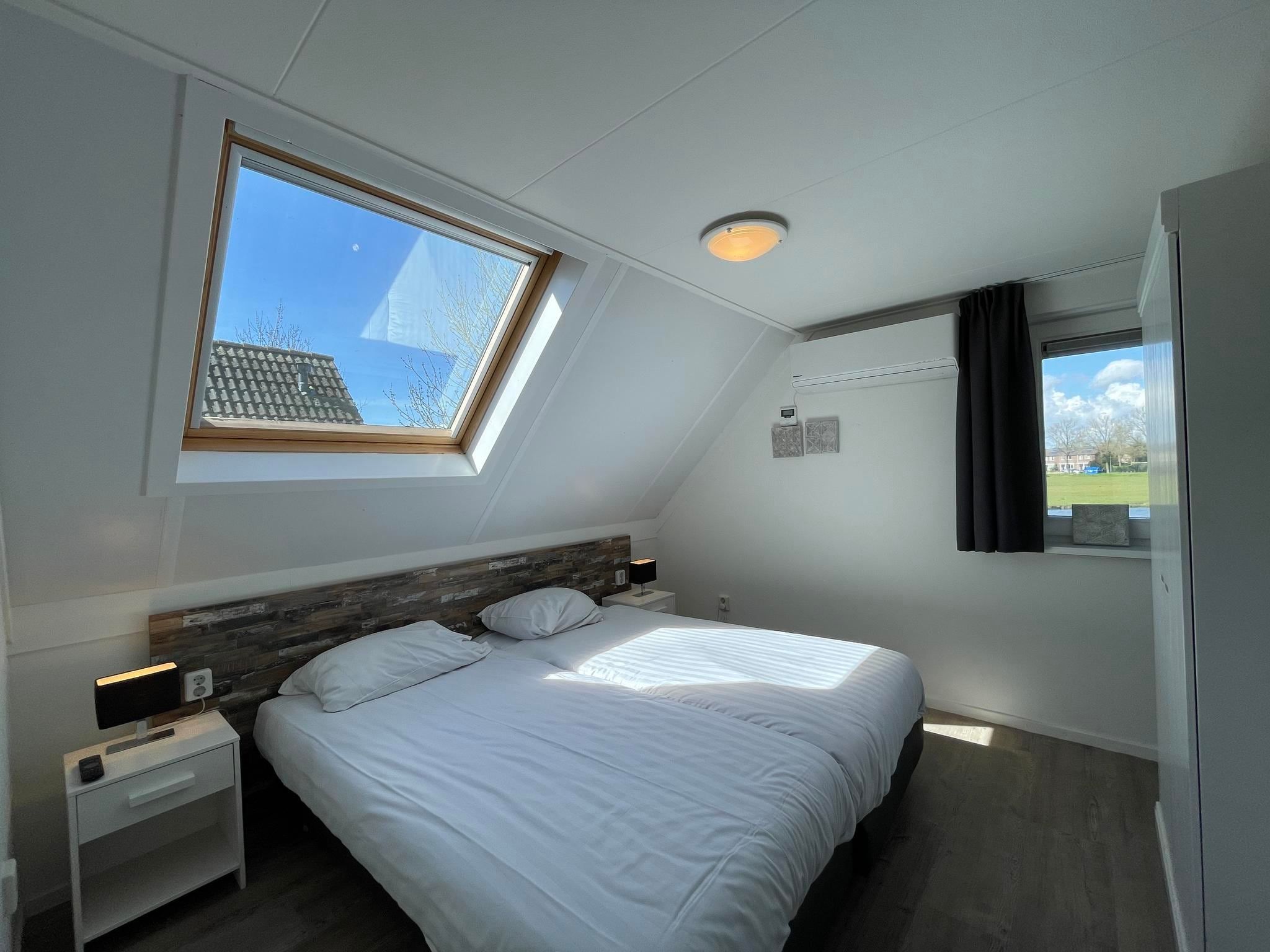 Een slaapkamer van Dijkhuis Wellness 6 in Medemblik