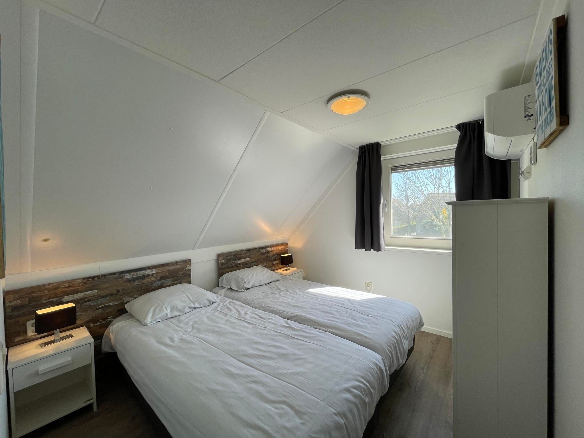 Een slaapkamer van Dijkhuis Wellness 6 in Medemblik