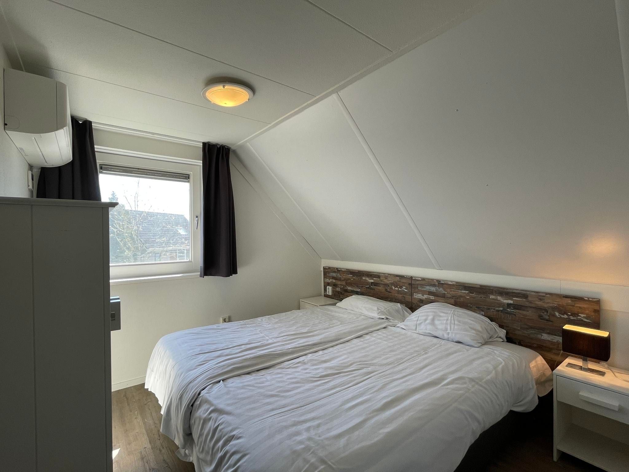 Een slaapkamer van Dijkhuis Wellness 6 in Medemblik