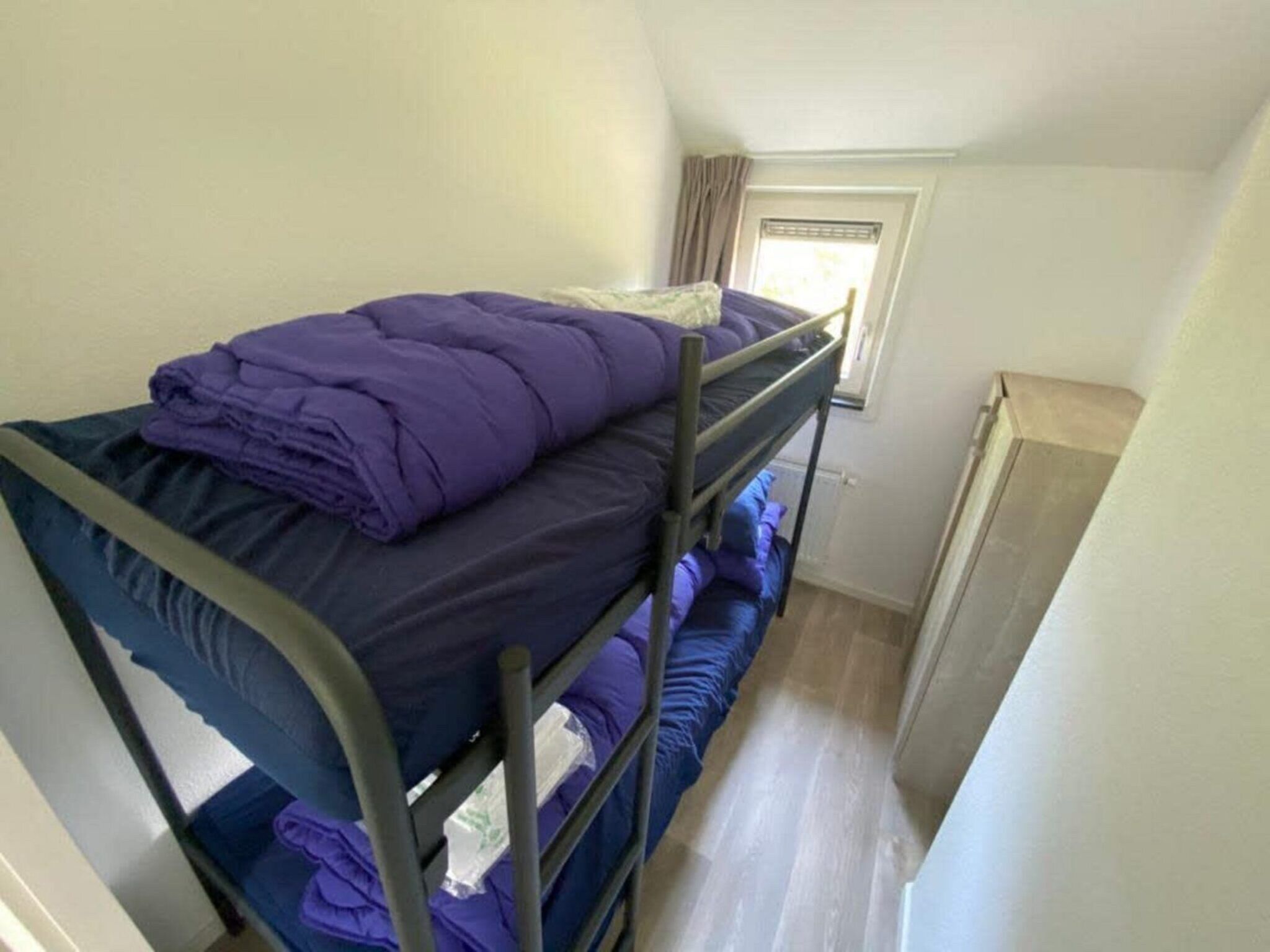 Een slaapkamer van Villa MIVA 8 in Otterlo