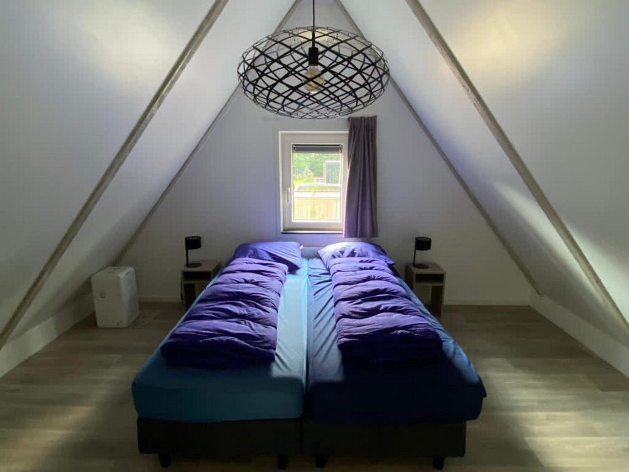 Een slaapkamer van Villa MIVA 8 in Otterlo