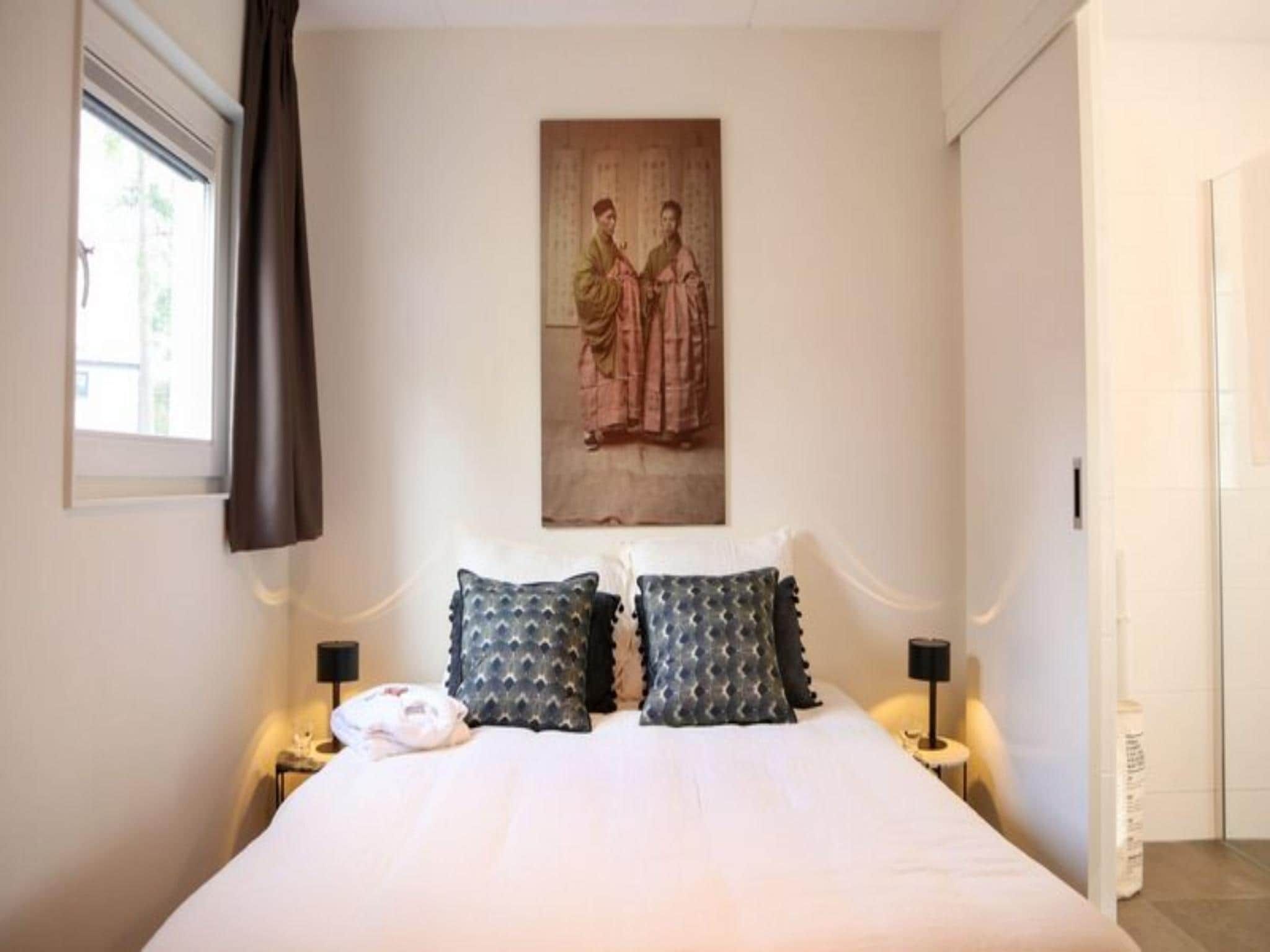 Een slaapkamer van Strandvilla Sauna 6 in Otterlo