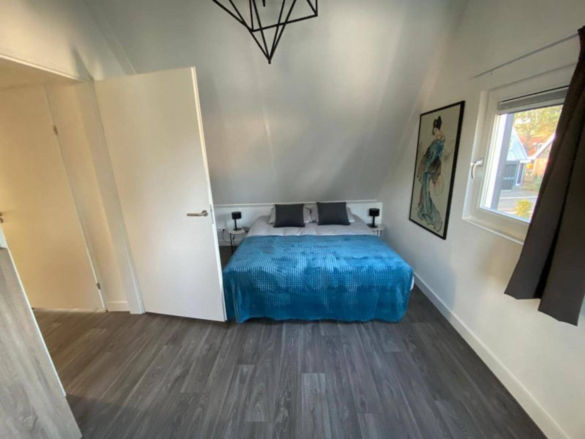 Een slaapkamer van Strandvilla Sauna 6 in Otterlo