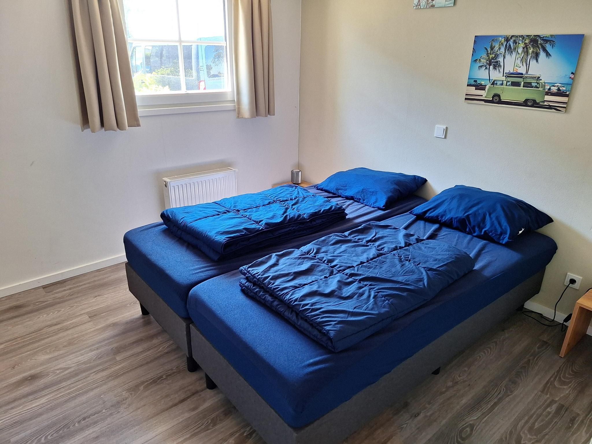 Een slaapkamer van Tulpenhof Villa  10 personen in West-Graftdijk