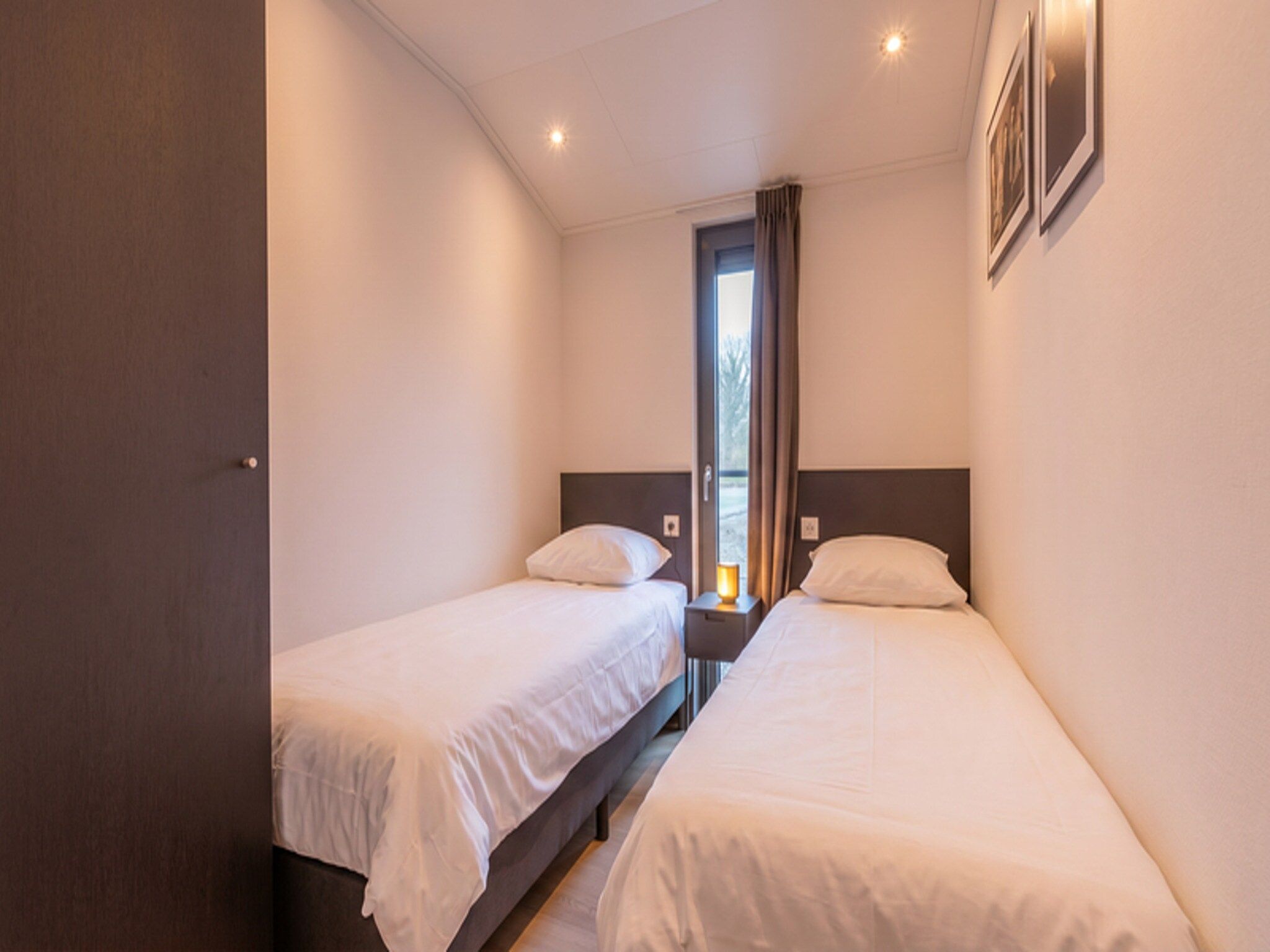 Een slaapkamer van Cube Split Culinair Wellness 6 in Enkhuizen