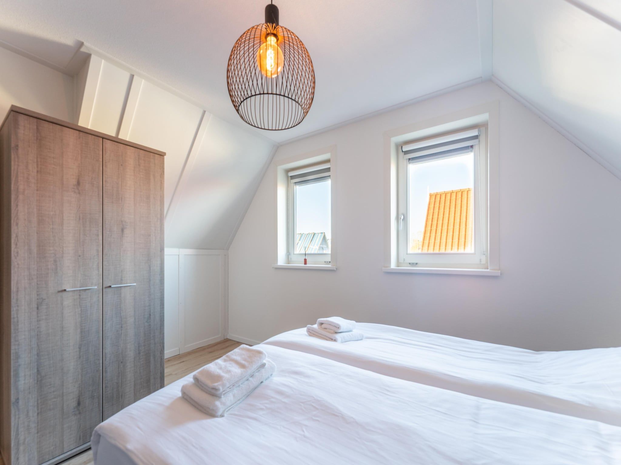 Een slaapkamer van Wulpdal 63 in Scherpenisse