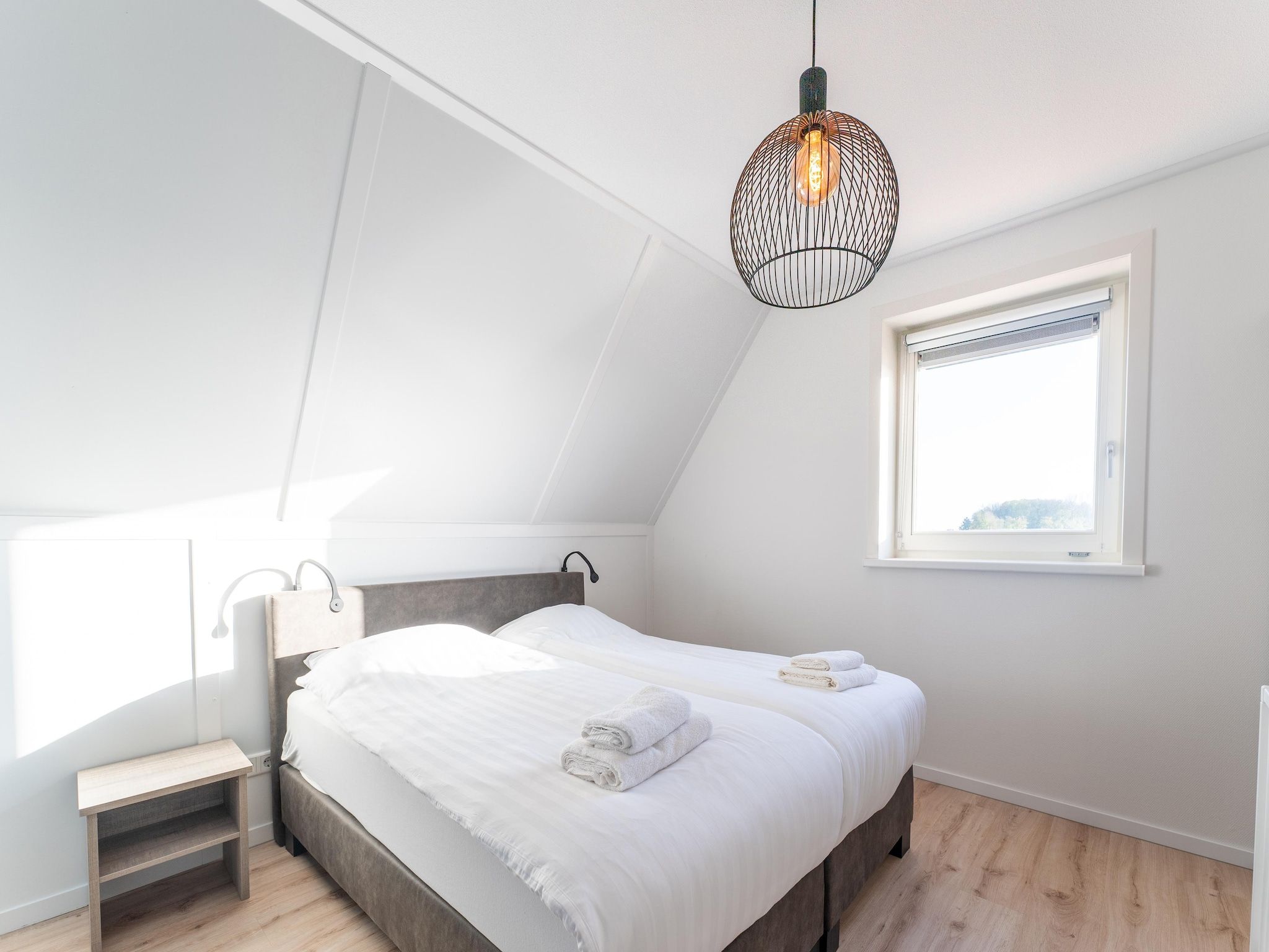 Een slaapkamer van Wulpdal 63 in Scherpenisse