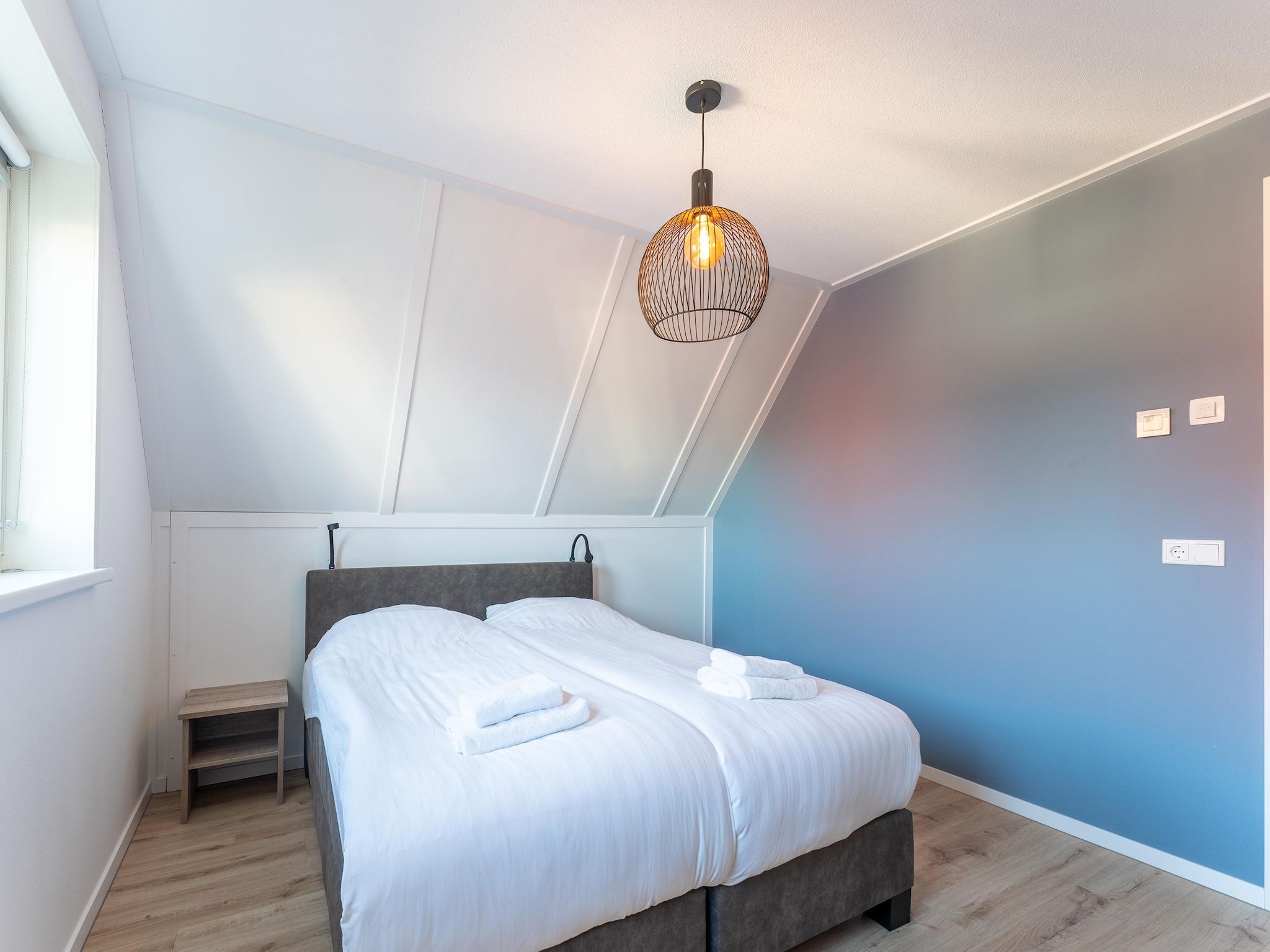 Een slaapkamer van Wulpdal 63 in Scherpenisse