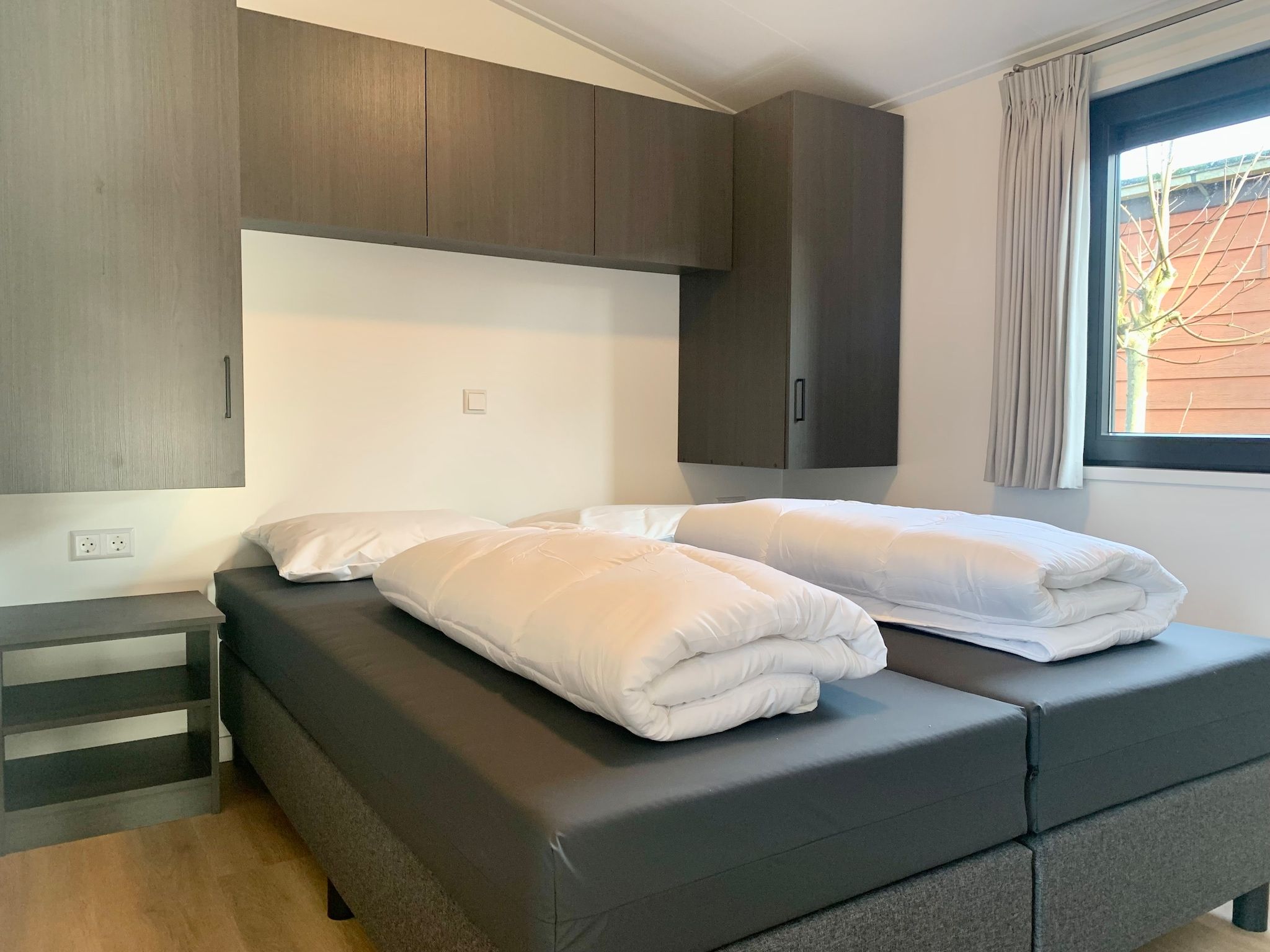 Een slaapkamer van Campanula 120 in Sint Maartenszee
