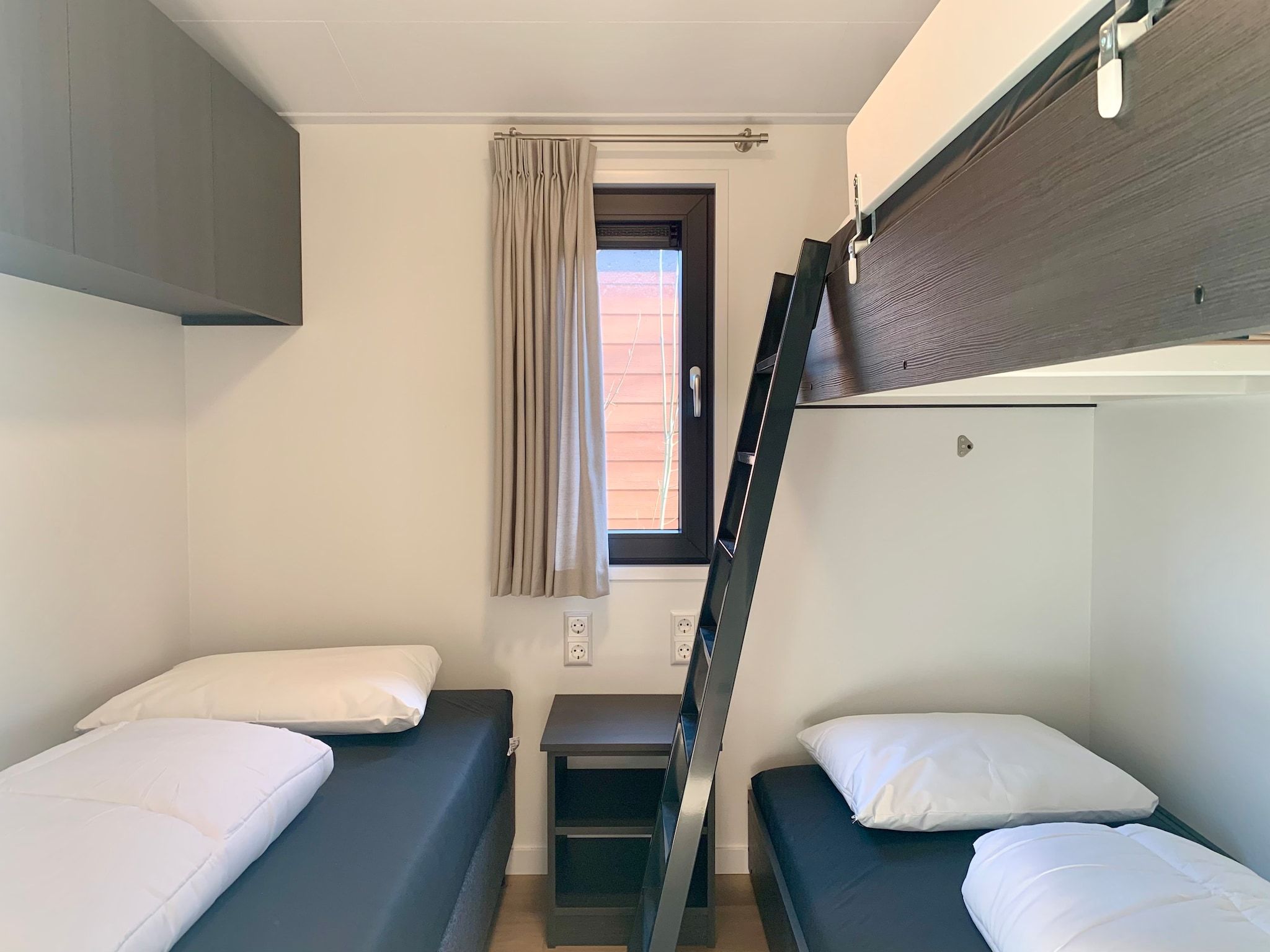 Een slaapkamer van Campanula 120 in Sint Maartenszee