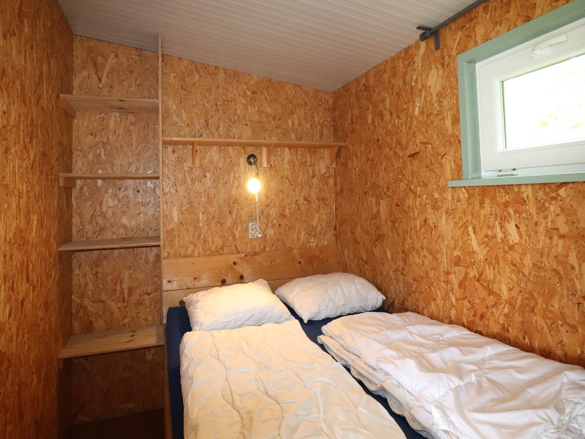 Een slaapkamer van Cosy cabin 2 in Heeg