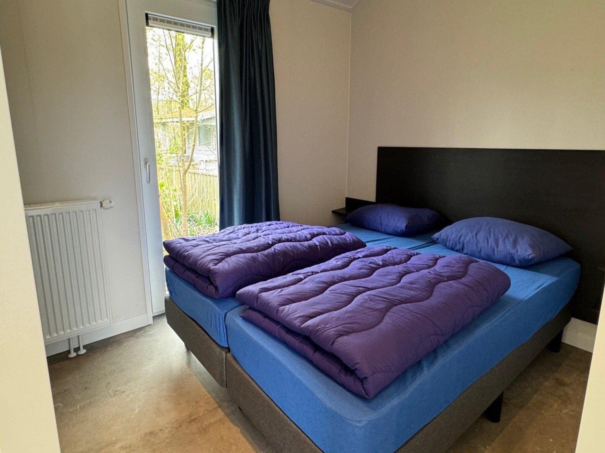 Een slaapkamer van Chalet Egel in Hengelo