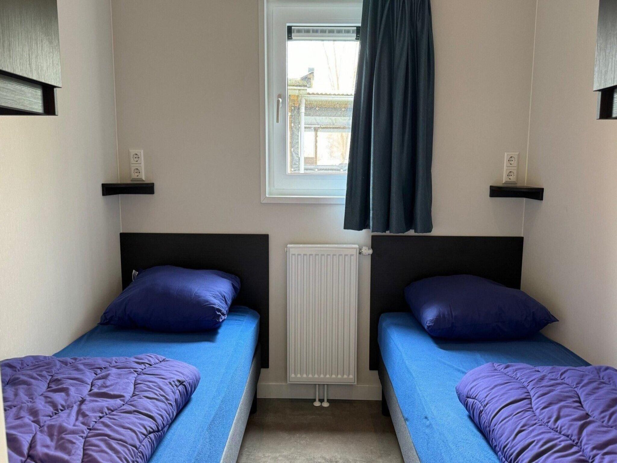 Een slaapkamer van Chalet Egel in Hengelo