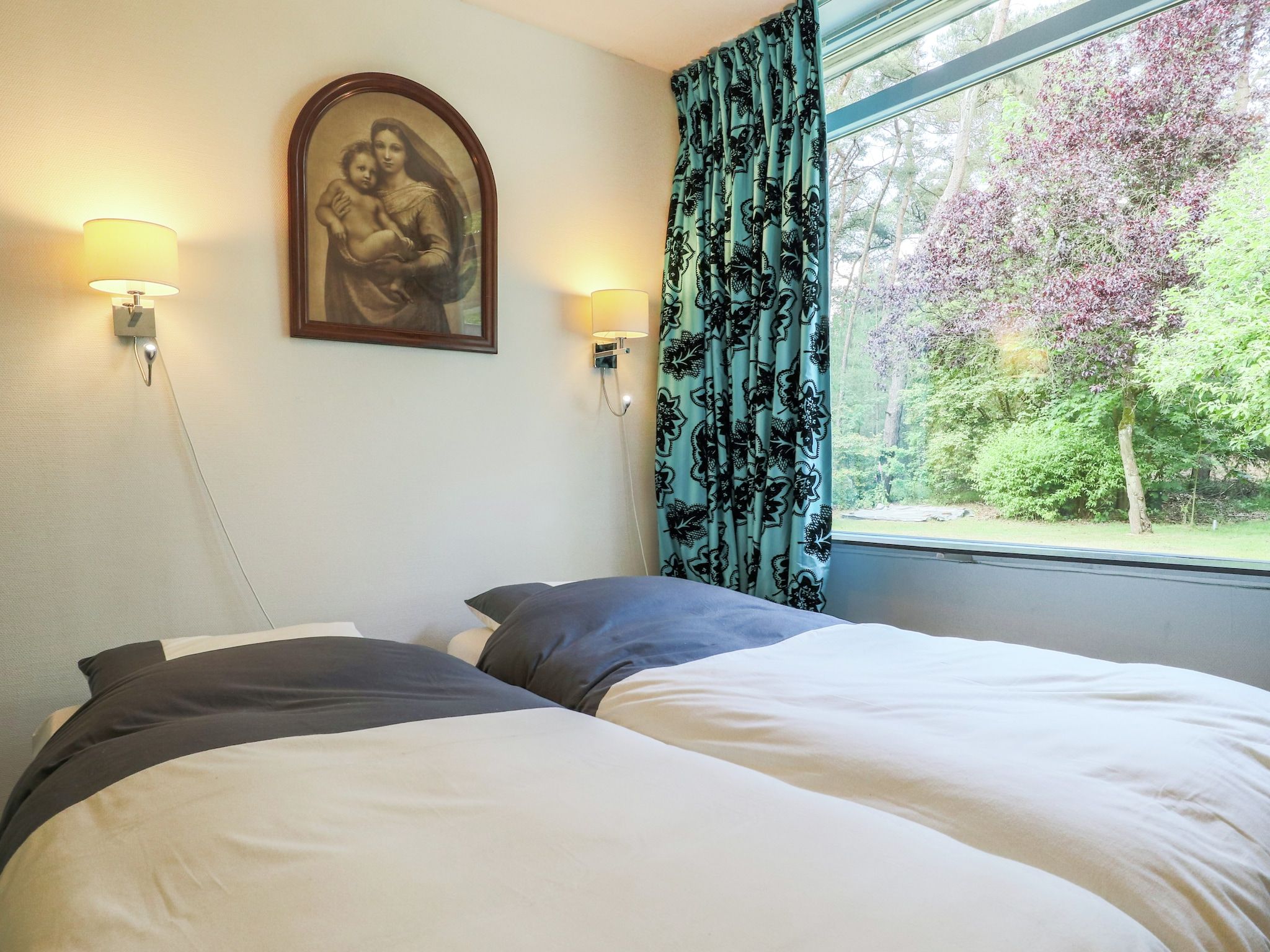 Een slaapkamer van Ruischende Dennen in Huybergen