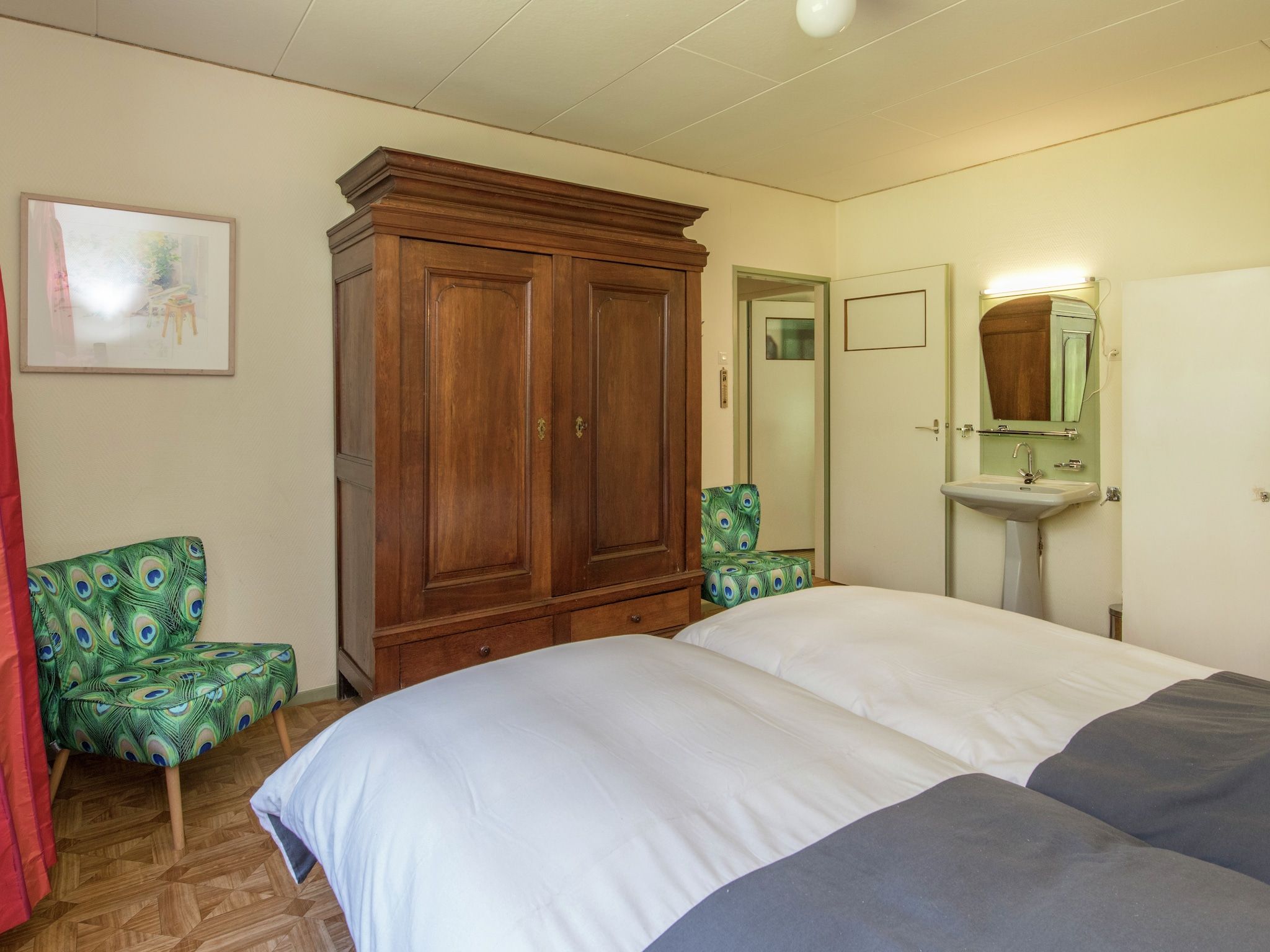 Een slaapkamer van Ruischende Dennen in Huybergen